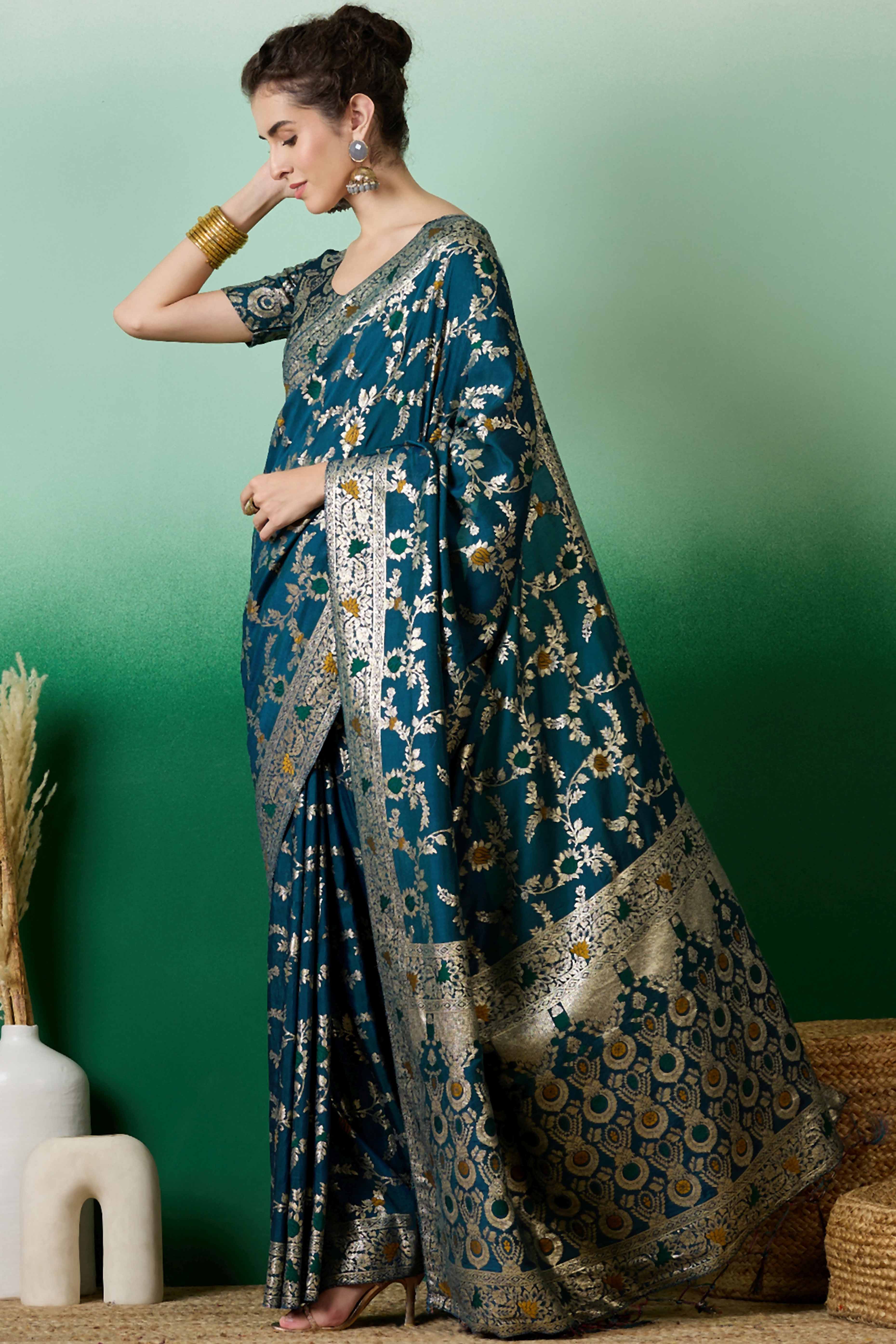 Teal Cotton Meena jacquard Saree Featuring Intricate Floral Weaving & Tassels On The Pallu