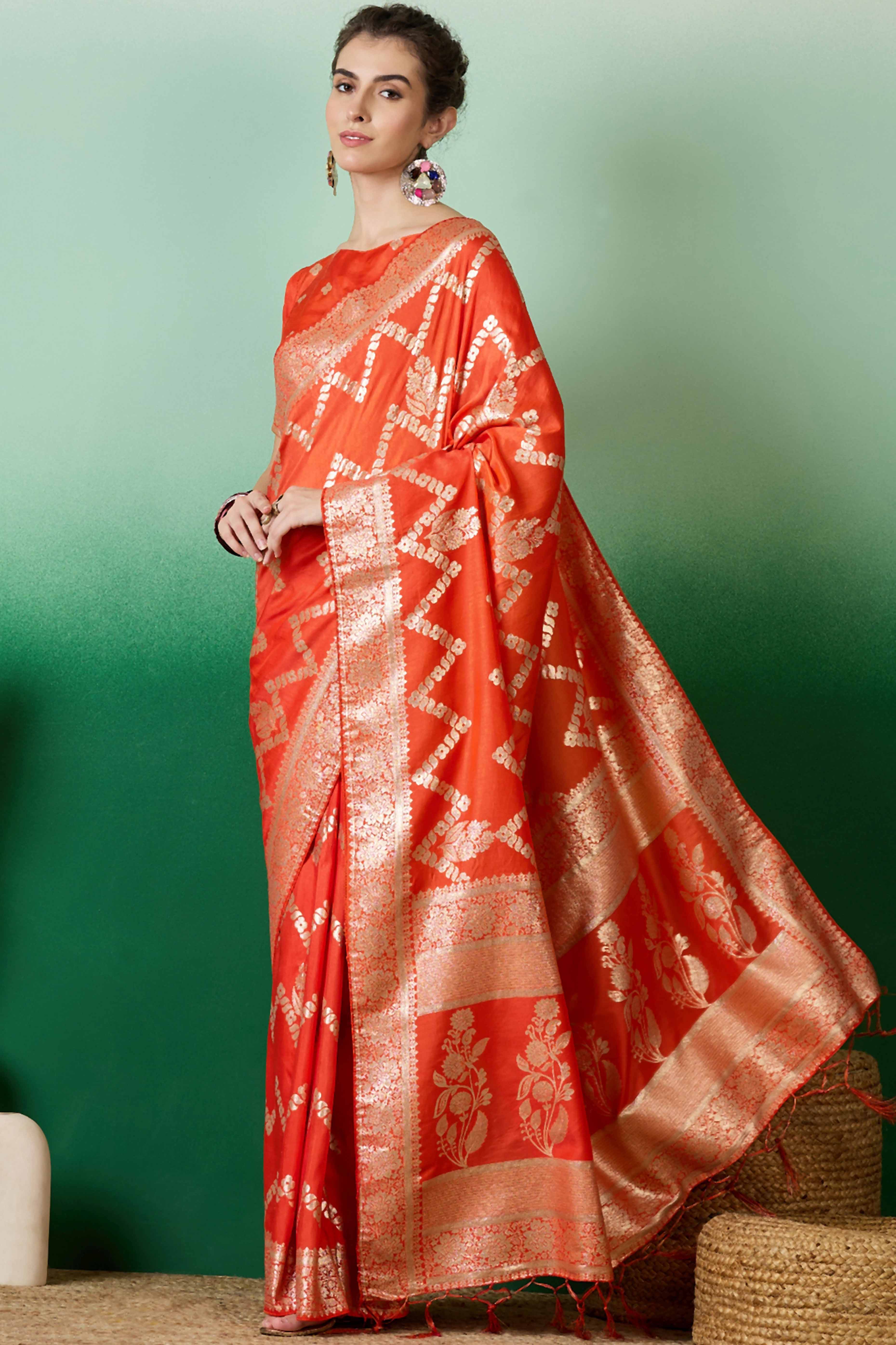 Orange Cotton Blend Jacquard Saree Adorned With Floral Weaving & Graceful Tassel Pallu