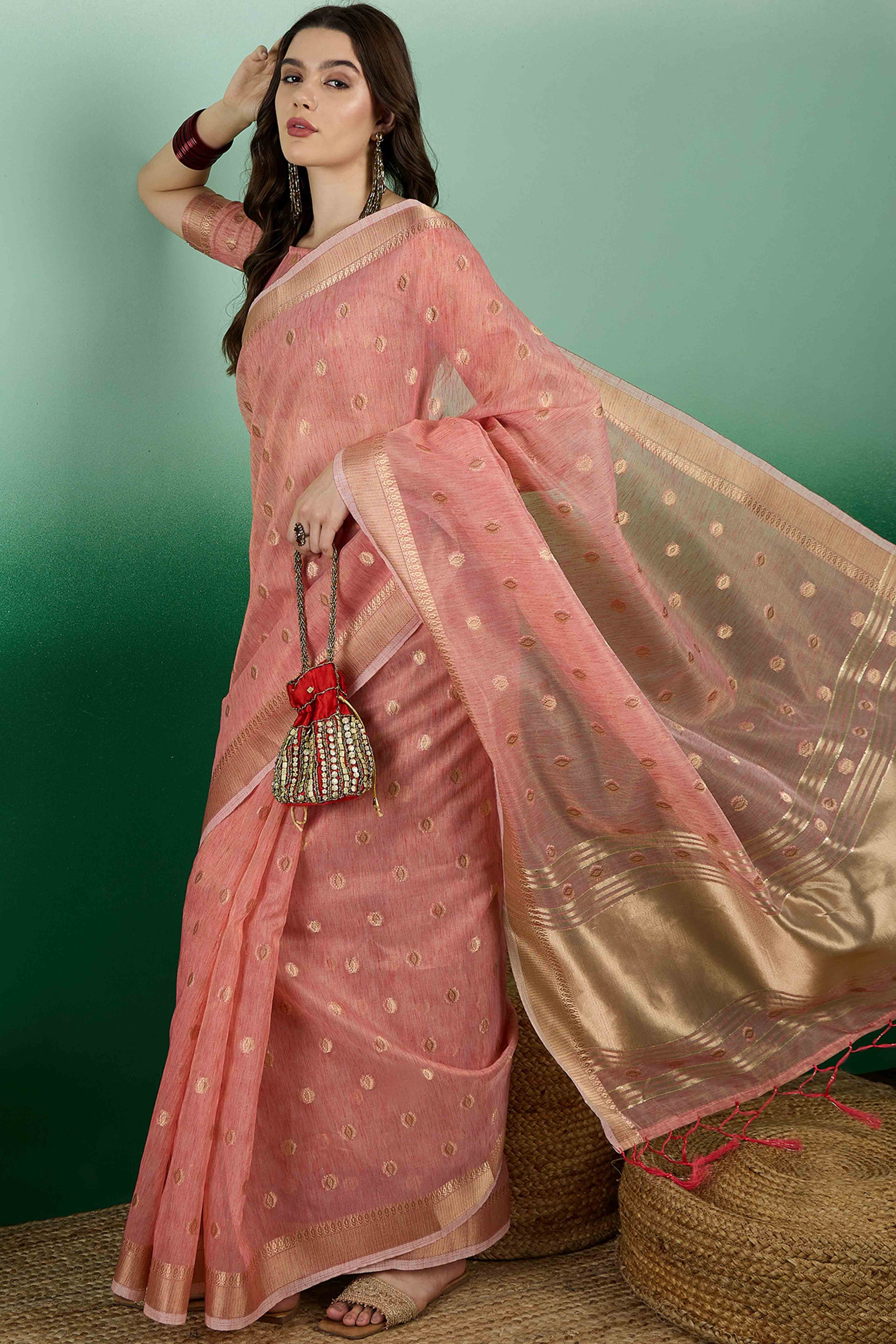 Peach Khadi Organza Saree Embellished With Traditional Zari Work & Tassels