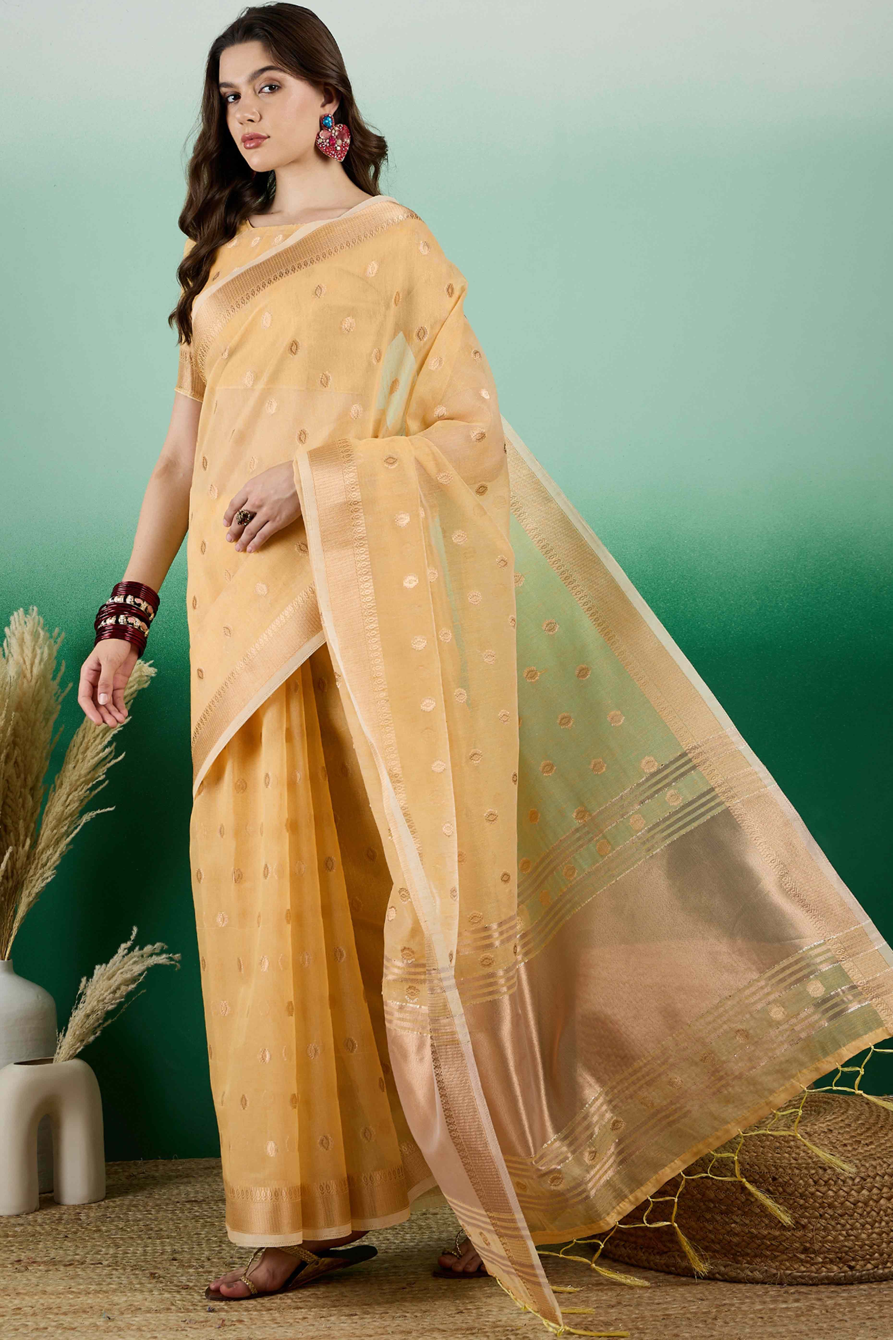 Yellow Khadi Organza Saree Embellished With Traditional Zari Work & Tassels