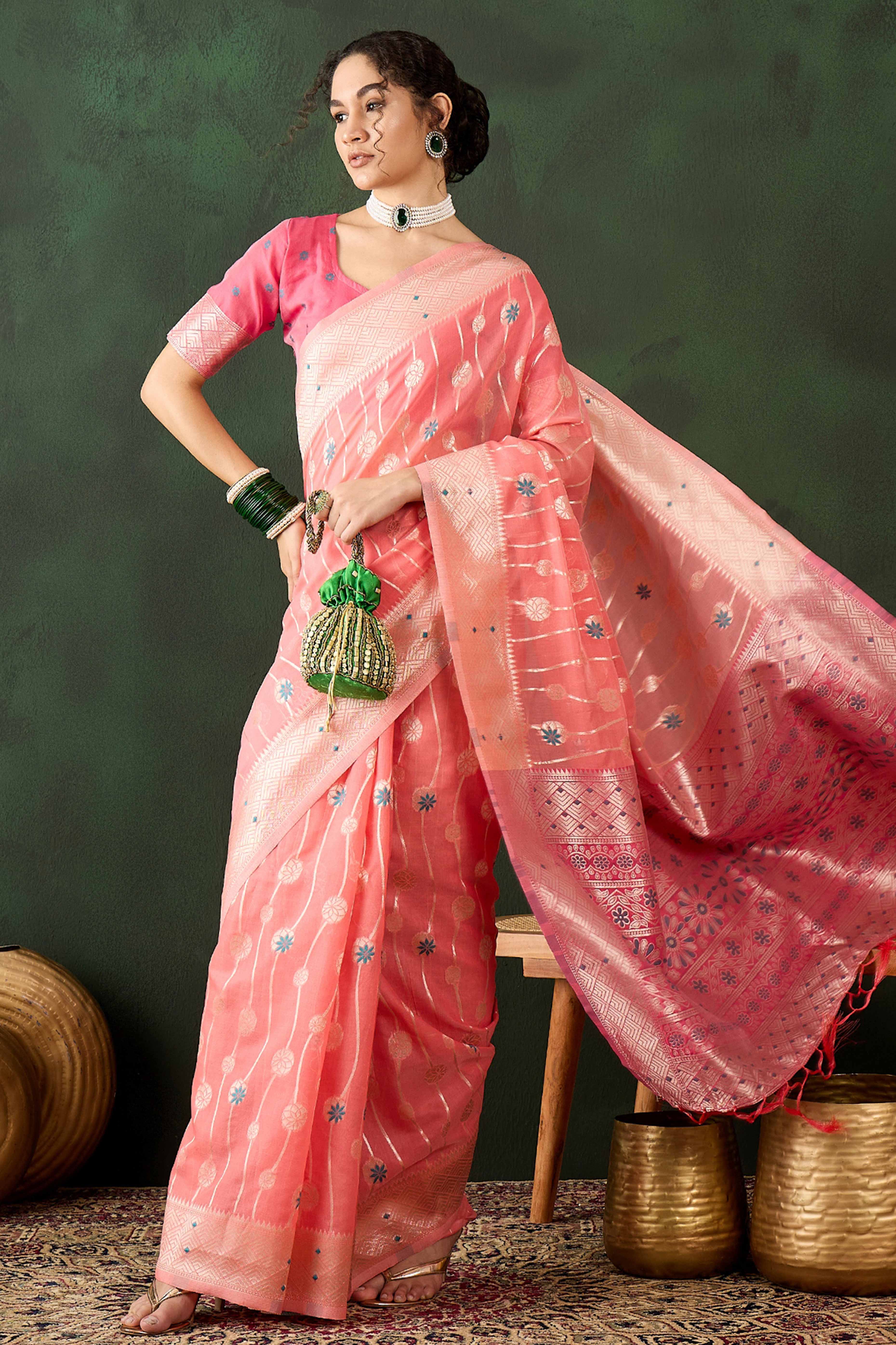 Peach Cotton Blend Saree Adorned With Intricate Floral Zari Weaving & A Stylish Tassel Pallu