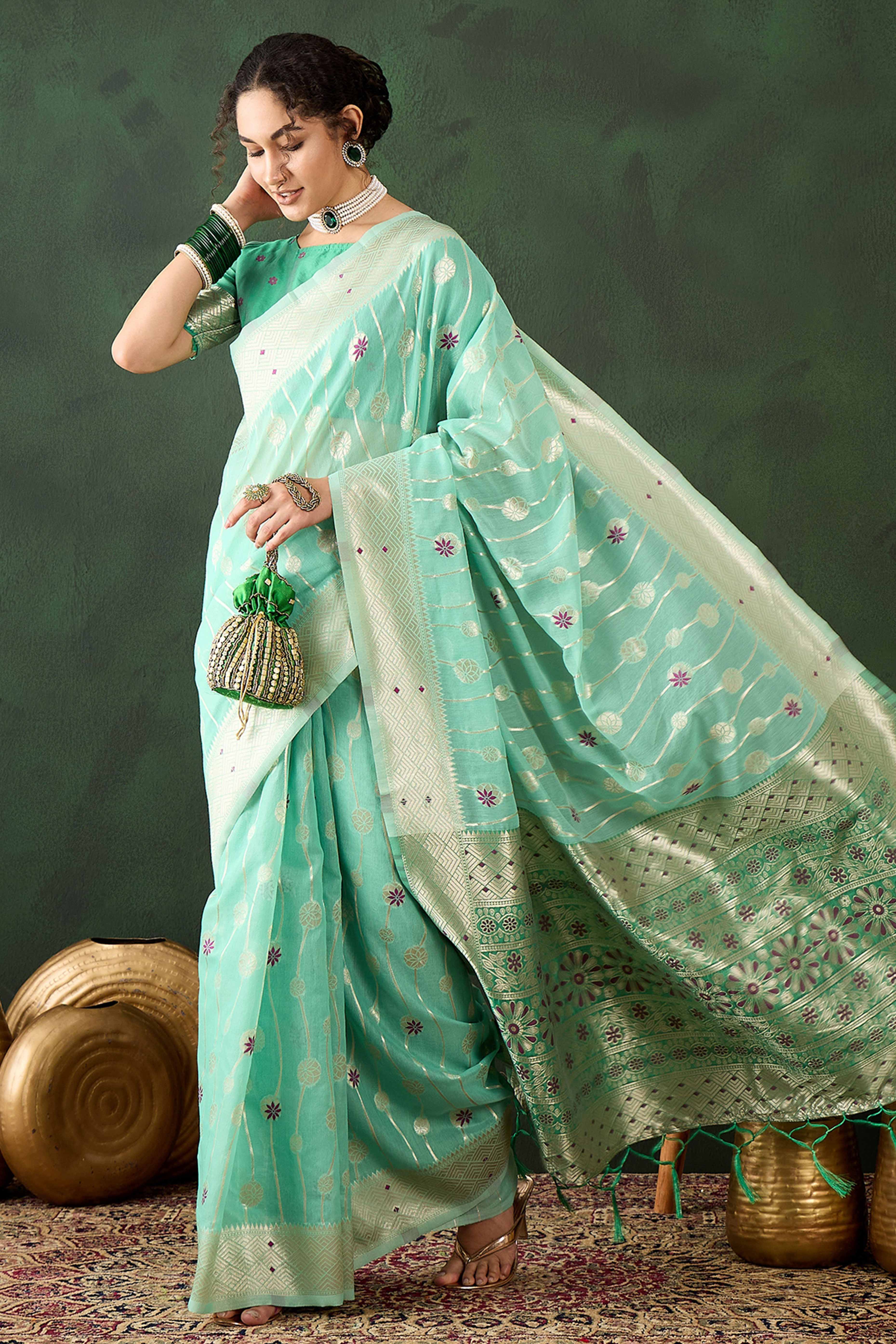Sea Green Cotton Blend Saree Adorned With Intricate Floral Zari Weaving & A Stylish Tassel Pallu