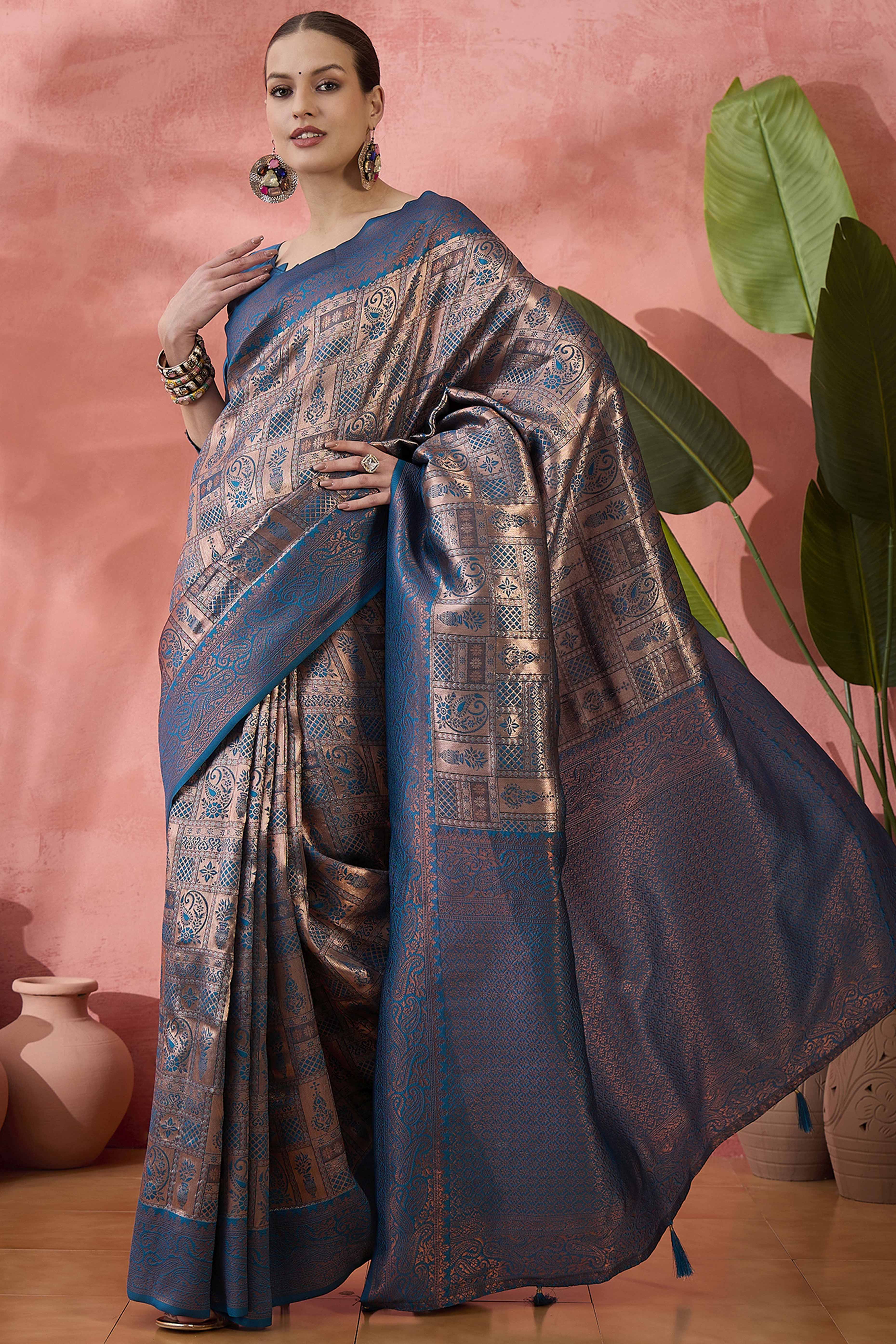 Blue Woven Poly Silk Blend Saree Featuring Floral & Paisley Motifs With Tassel Accents
