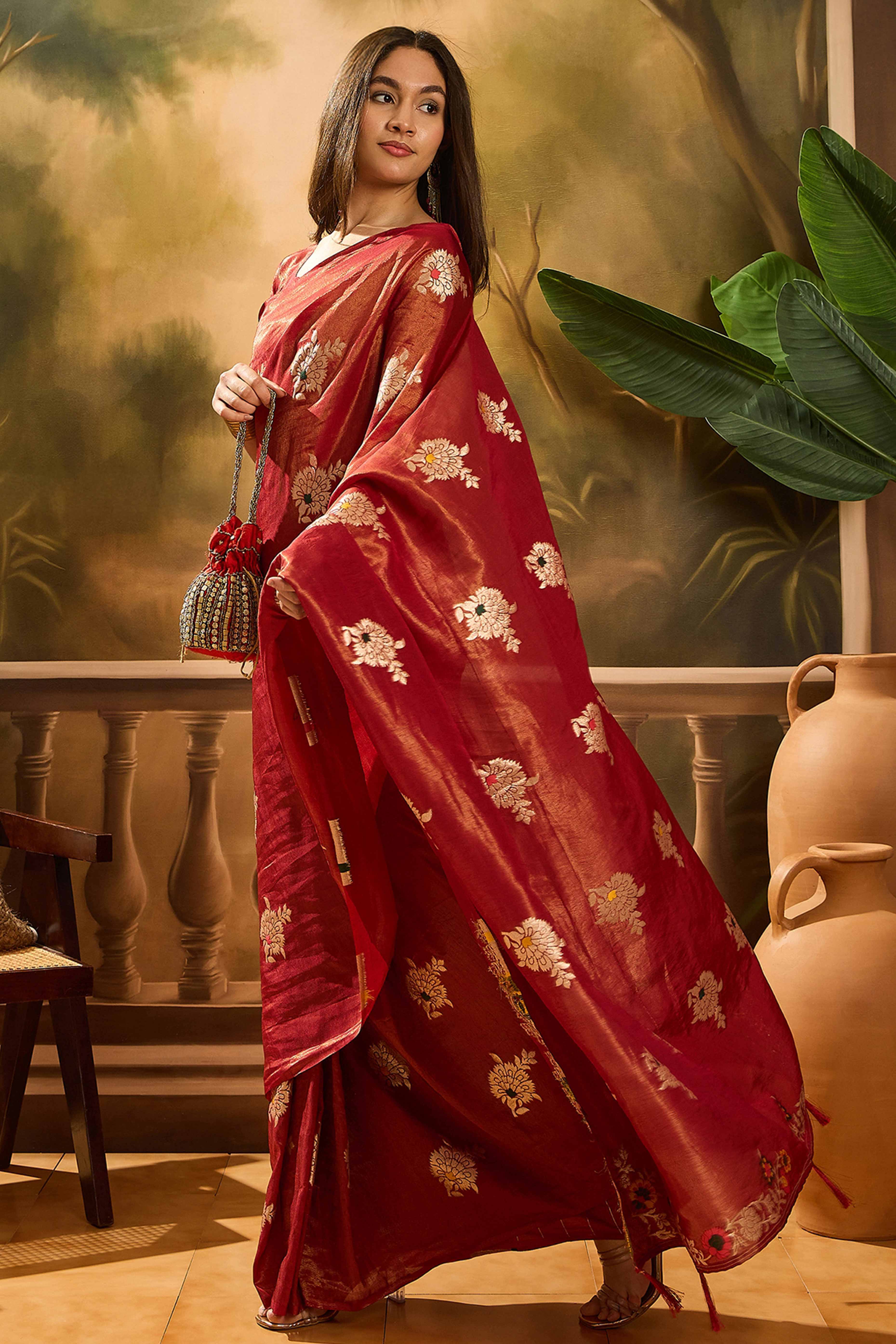 Maroon Shimmer Saree Featuring Intricate Floral Zari Weaving & Tassel Finish