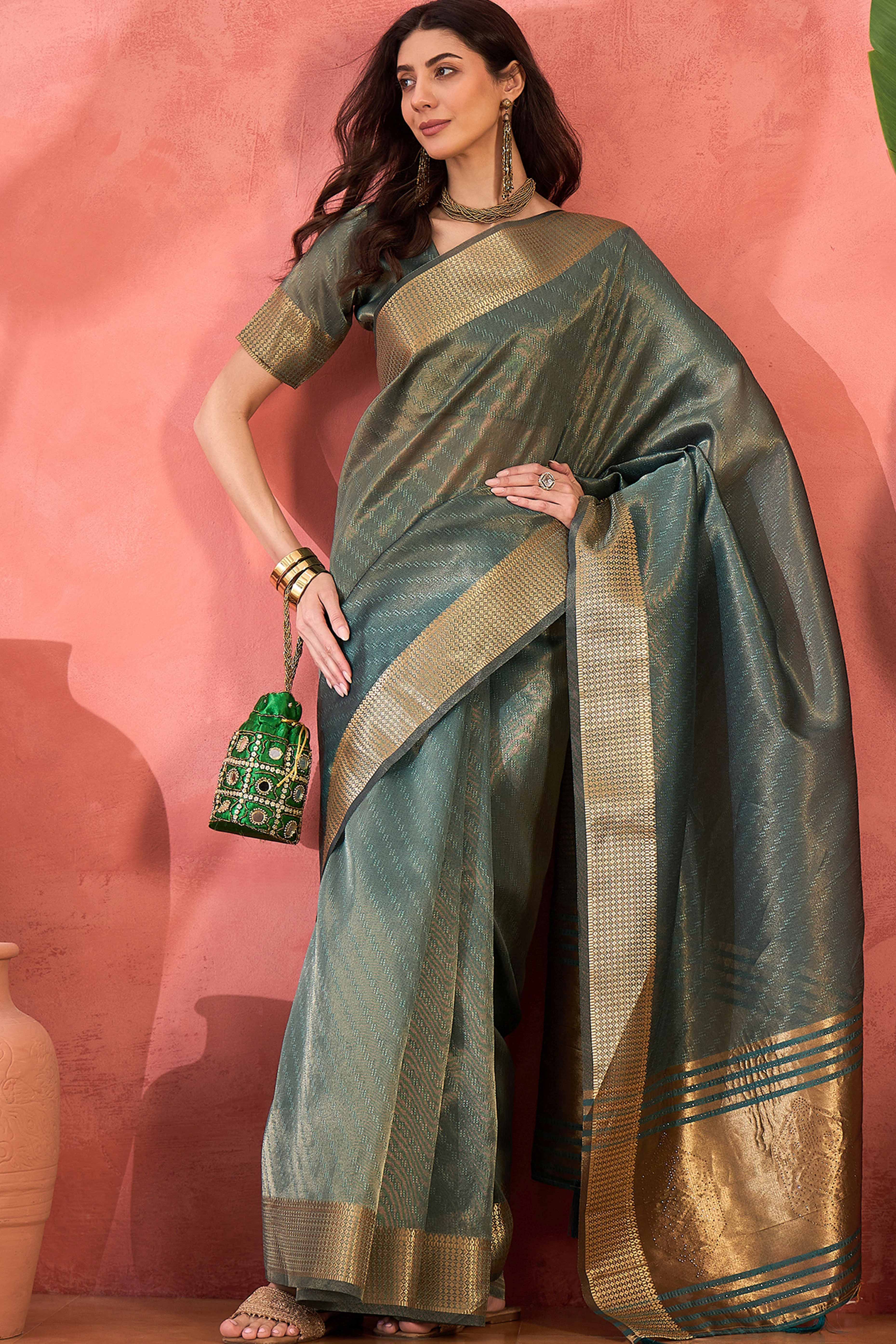 Teal Green Khadi Organza Saree Intricate Weaving & Sparkling Stonework With Tassel Pallu
