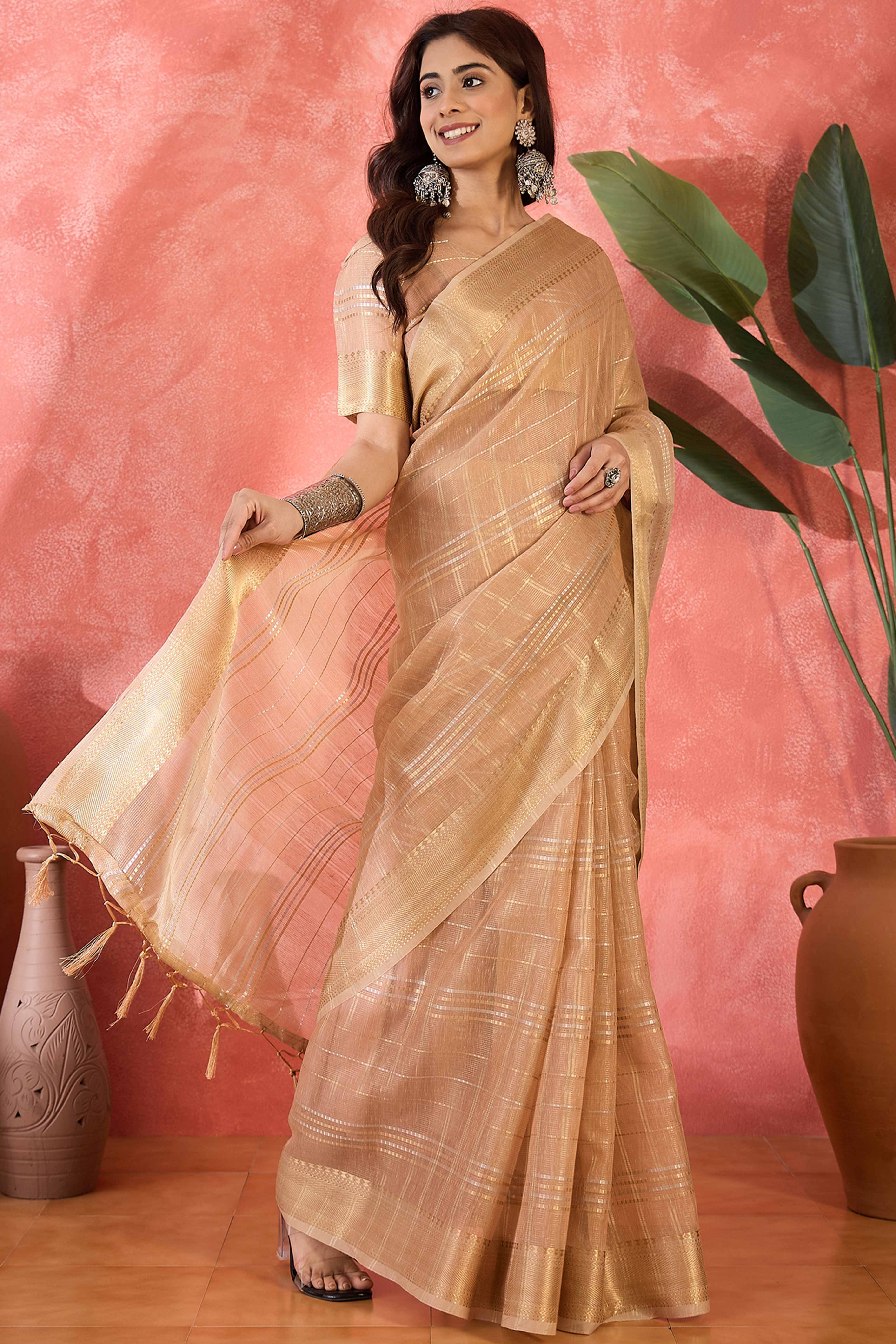 Light Peach Zari Woven Khadi Organza Saree Featuring Classic Checks & Tassel Detailing