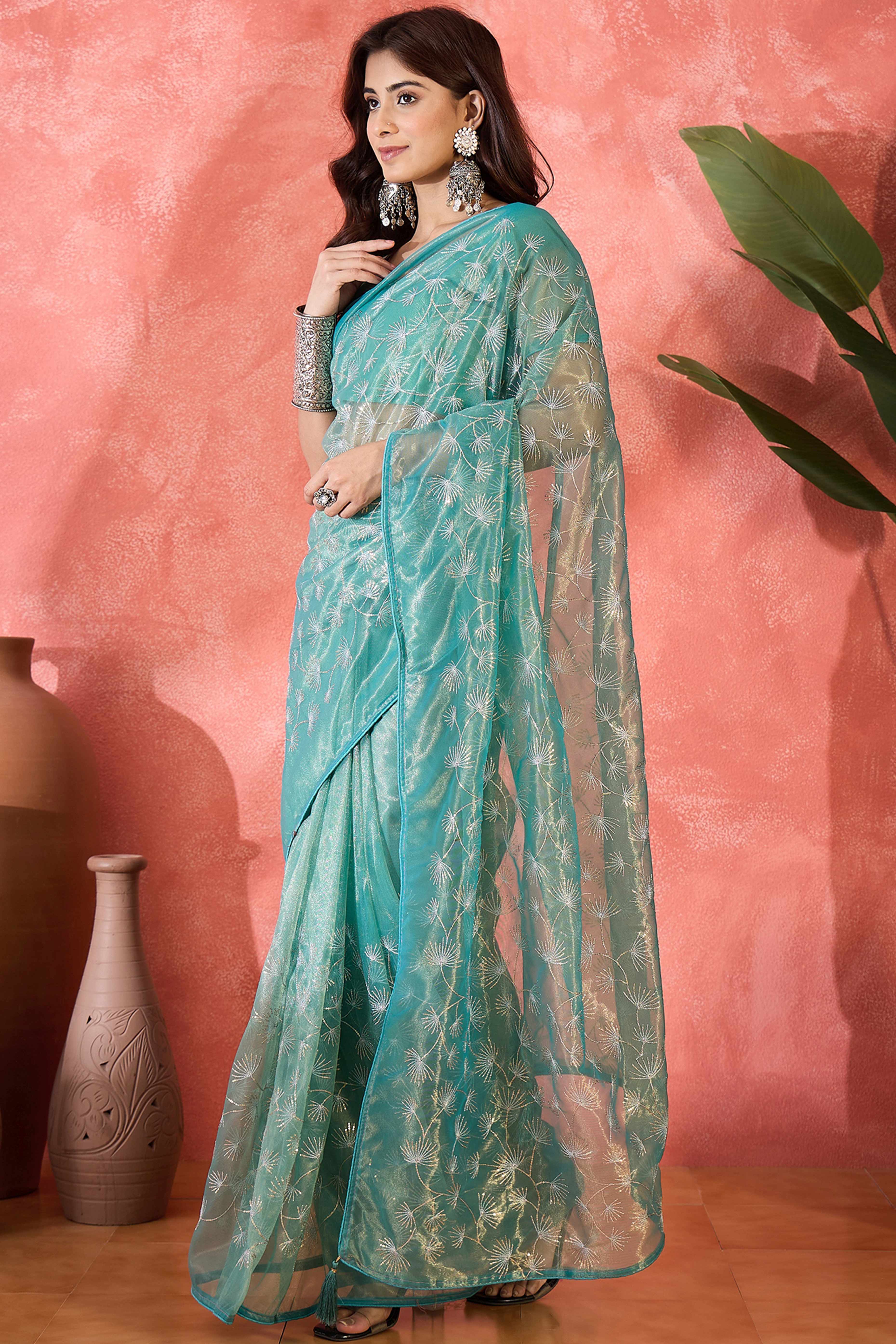 Turquoise Twill Net Saree With Intricate Floral Sequin Work & Flowing Tassel Pallu