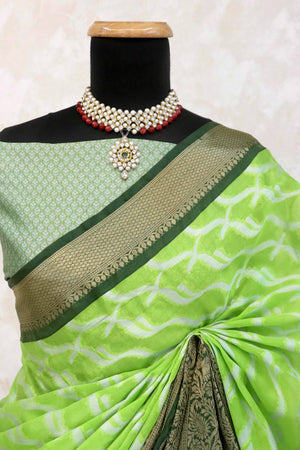 Parrrot Green Kanjivaram Silk Saree Adorned With Zari Weaving & Graceful Tassels