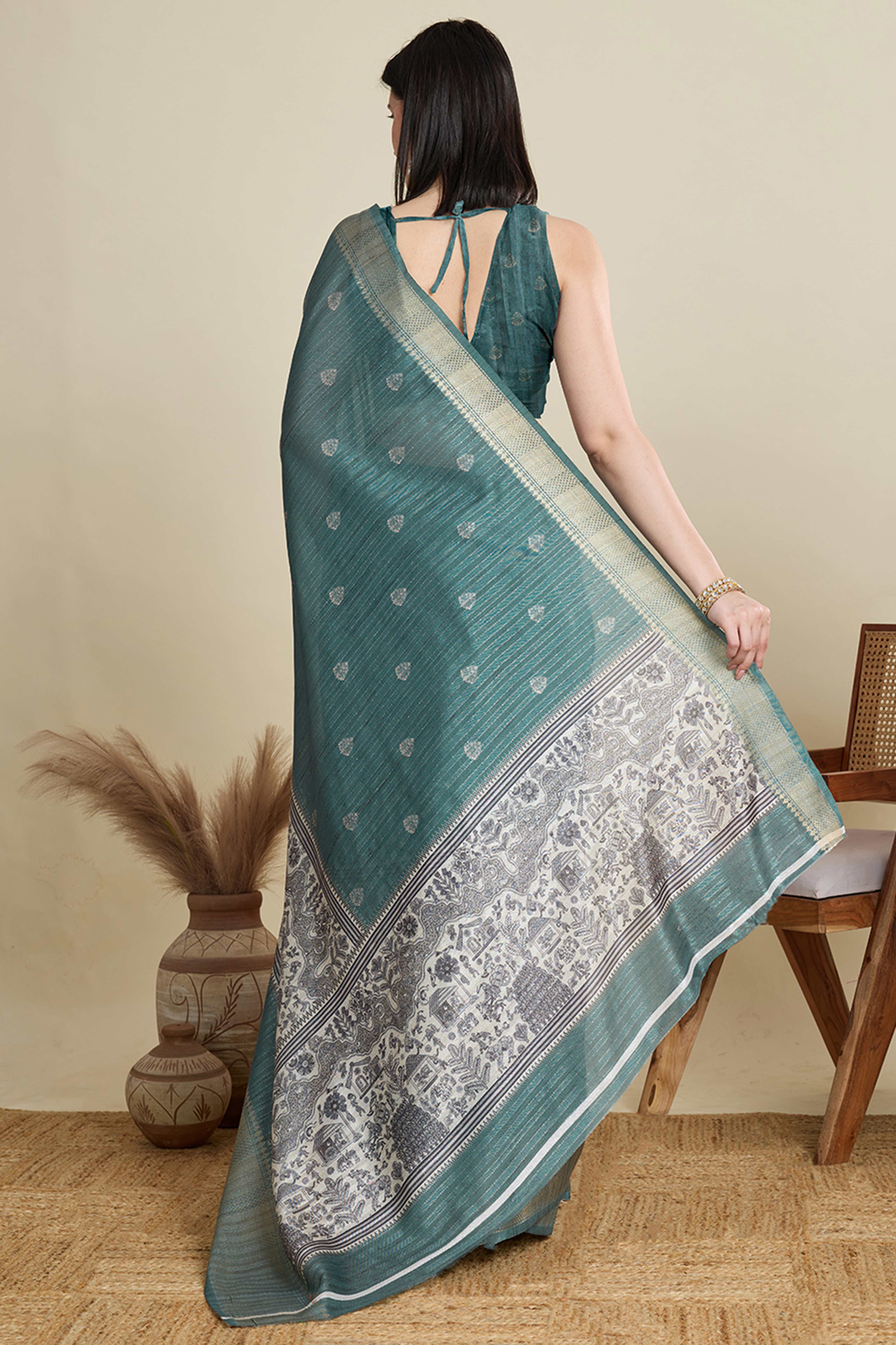 Sea Green Cotton Blend Saree Featuring Floral Prints and a Festive Zari Border Accent