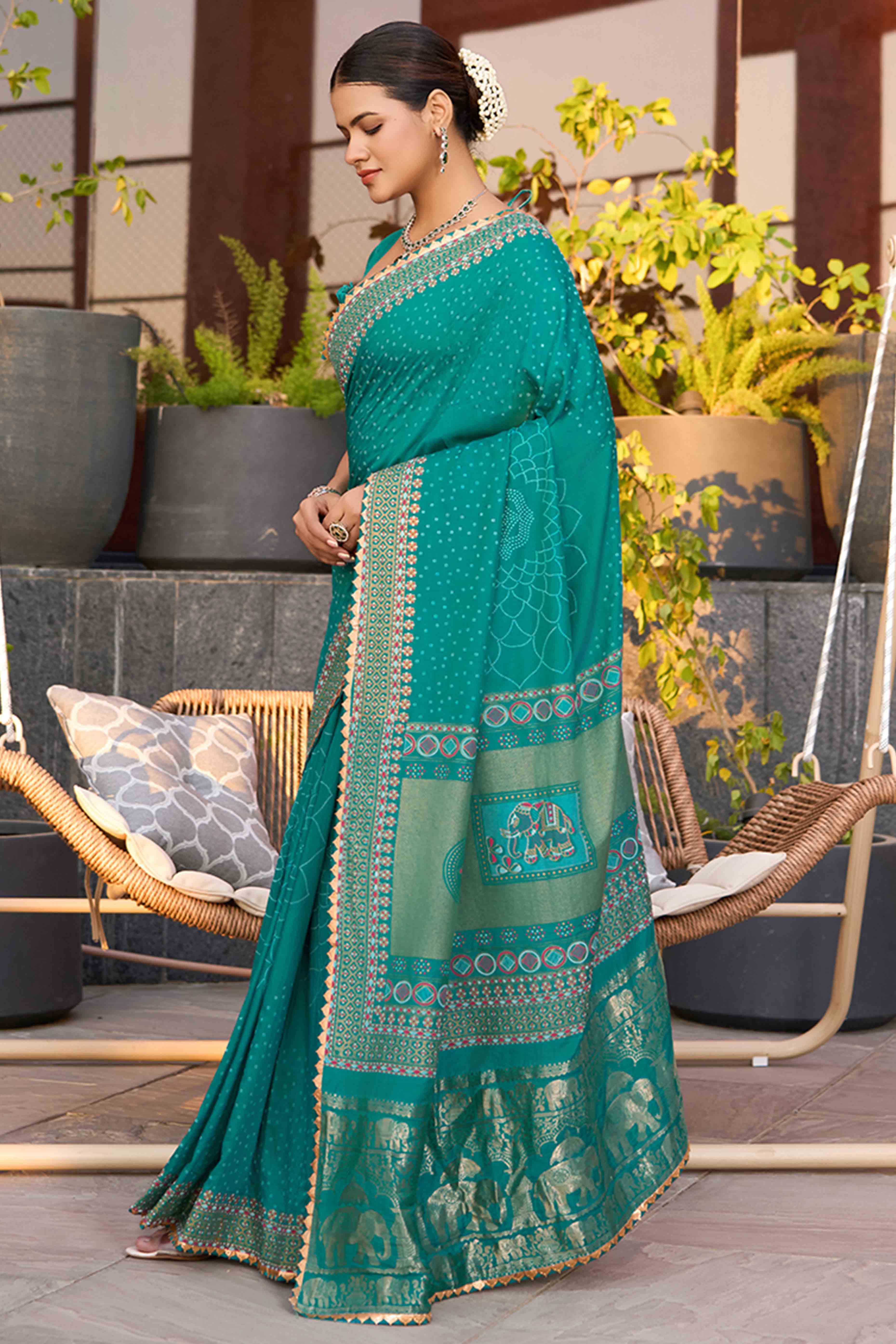 Drape Yourself In The Charm Of Rama Blue Bandhani Foil Printed Cotton Silk Sarree With Lace Border