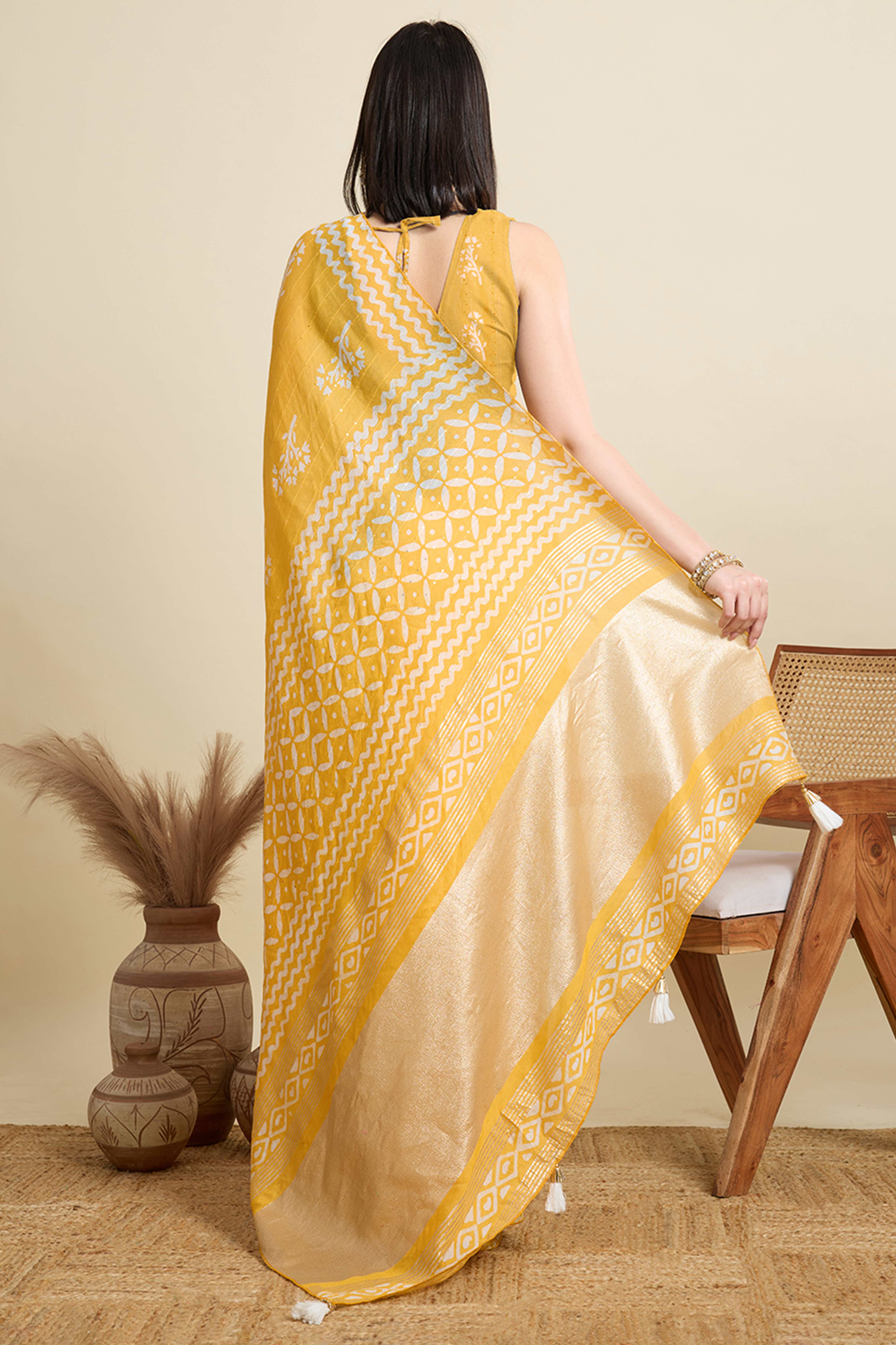 Yellow Cotton Blend Saree Featuring Floral Prints and Elegant Sequins Work Accents