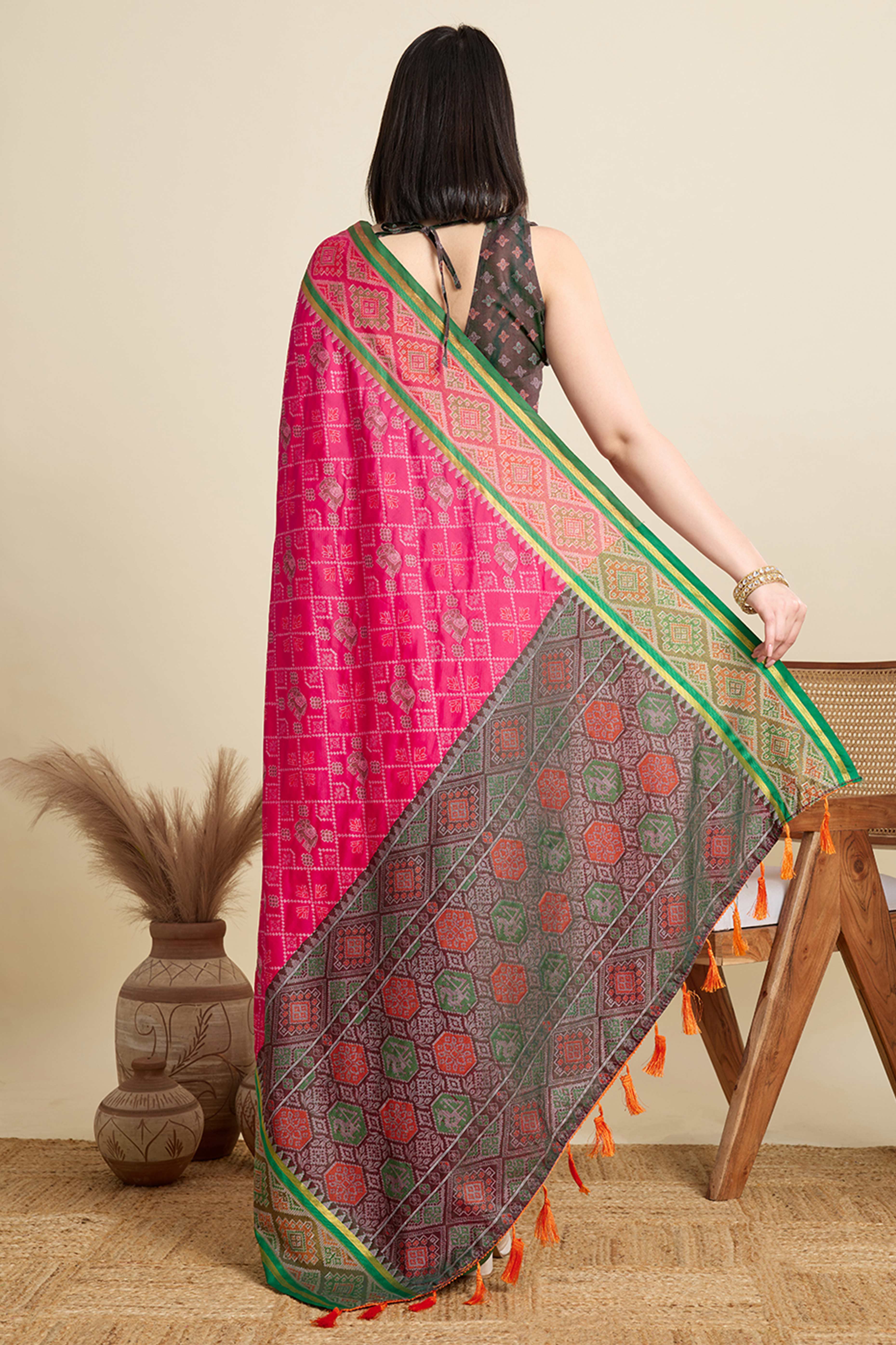 Pink Silk Blend Saree Featuring Patola Prints and a Detailed Weaving Border
