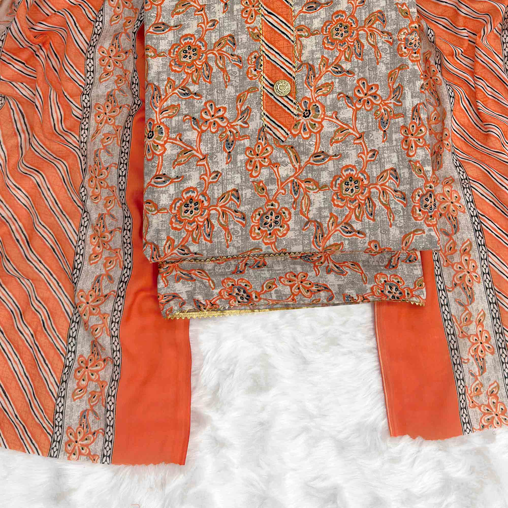 Charming Orange Floral Printed Cotton Blend Dress Material Featuring Intricate Lace Border