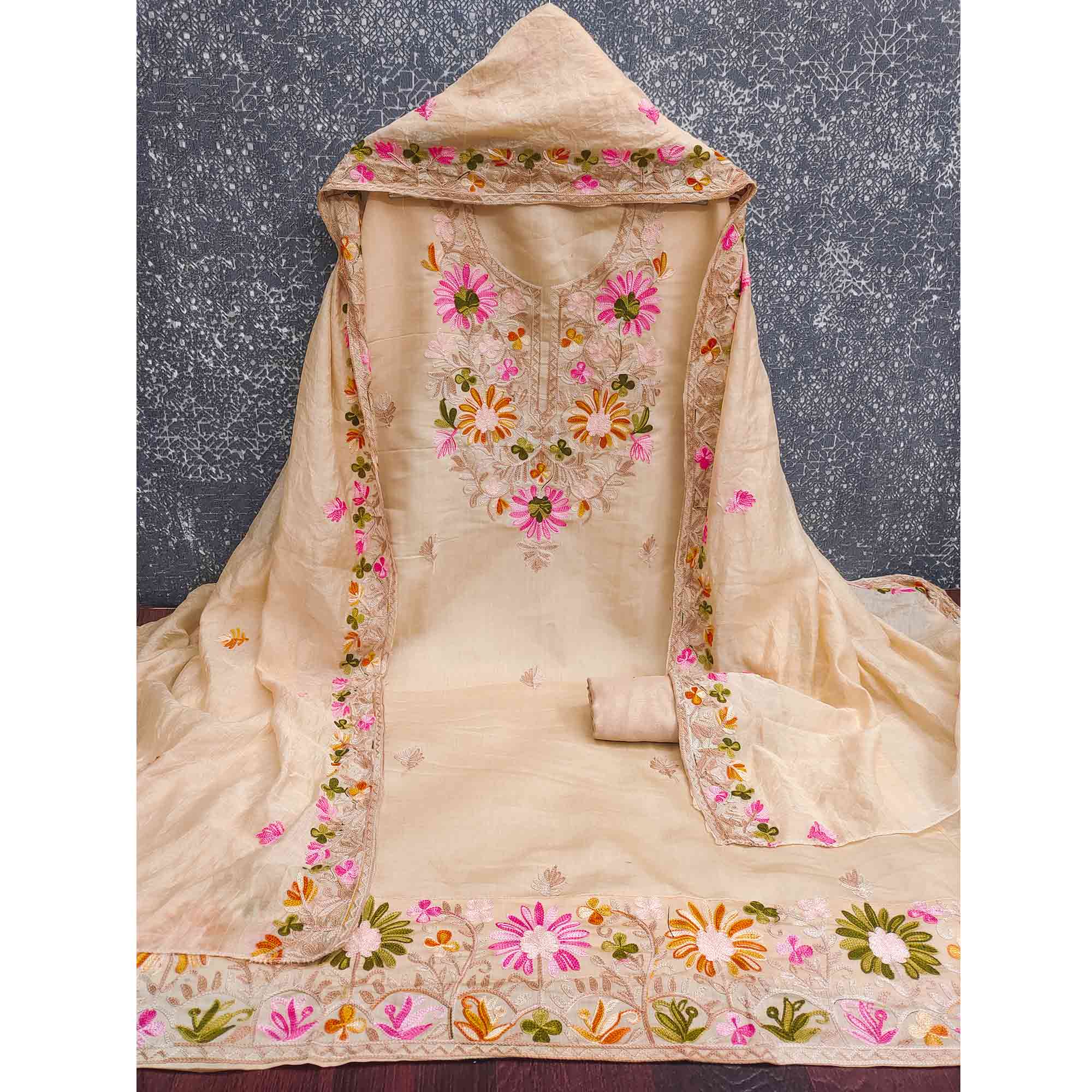 Chikoo Designer Roman Art Silk Dress Material Adorned With Floral Thread Embroidery Work