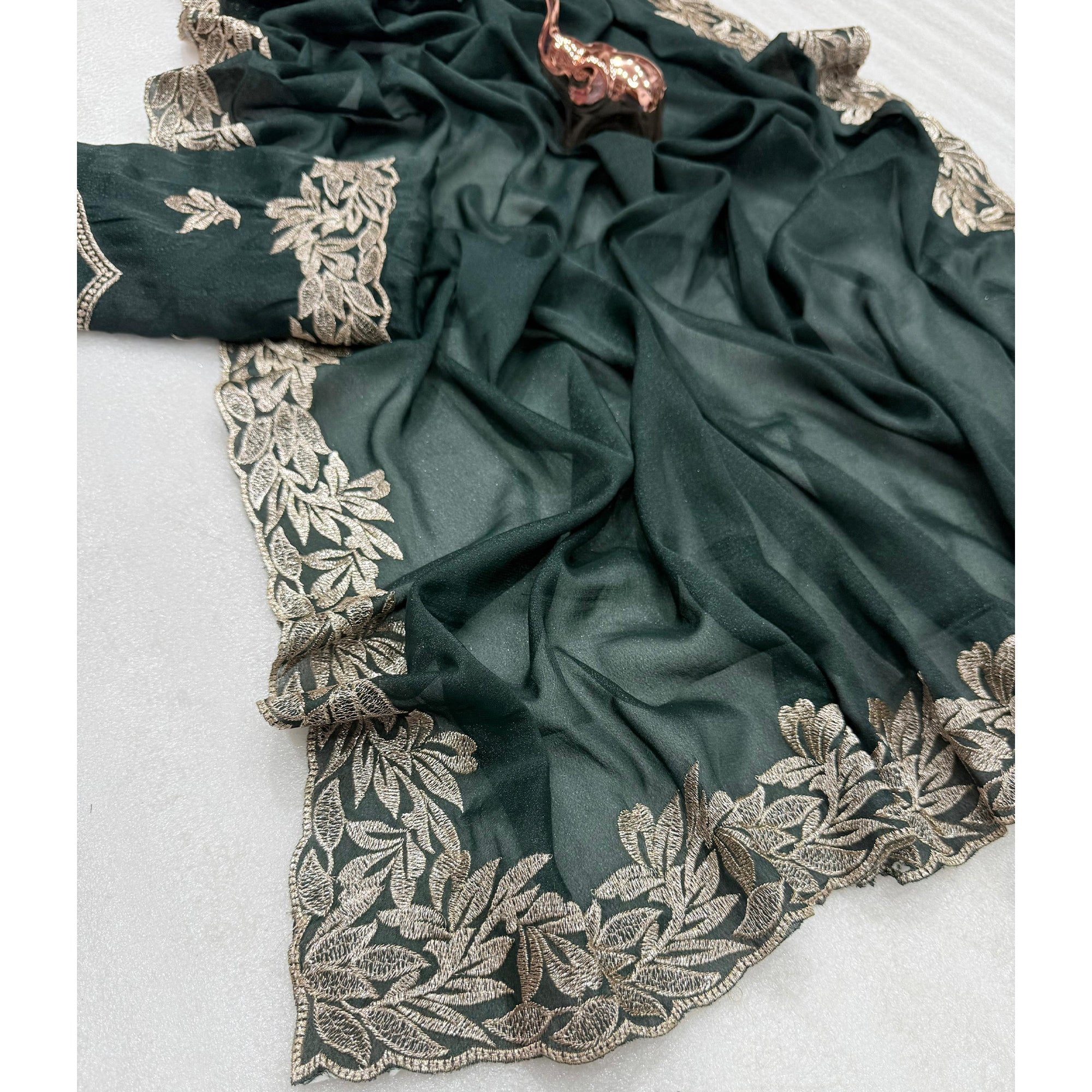 Stylish Dark Green Star Chiffon Saree with Traditional Zari Embellished Border