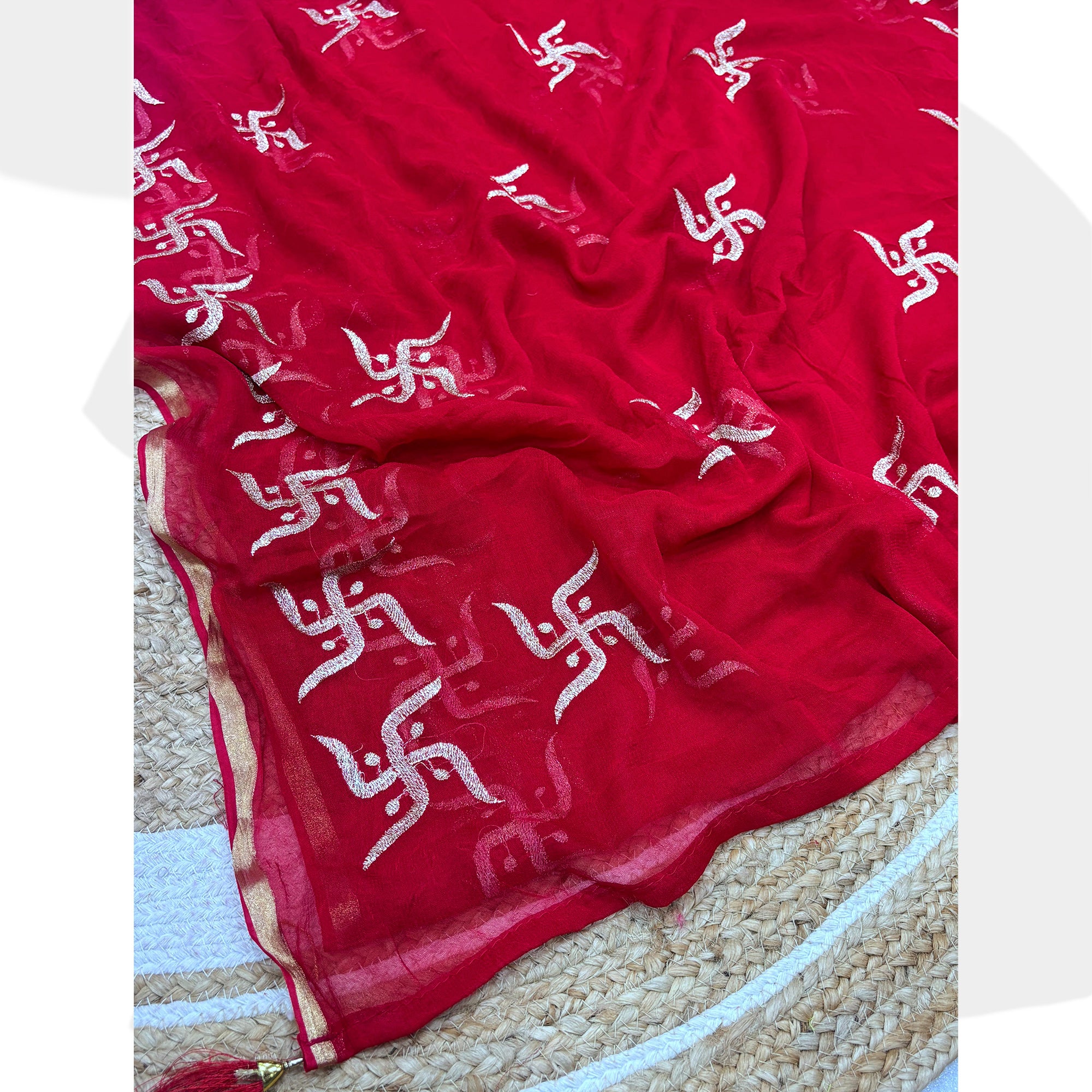 Festive Red Georgette Saree Enhanced with Fine Swastik Embroidered Motifs