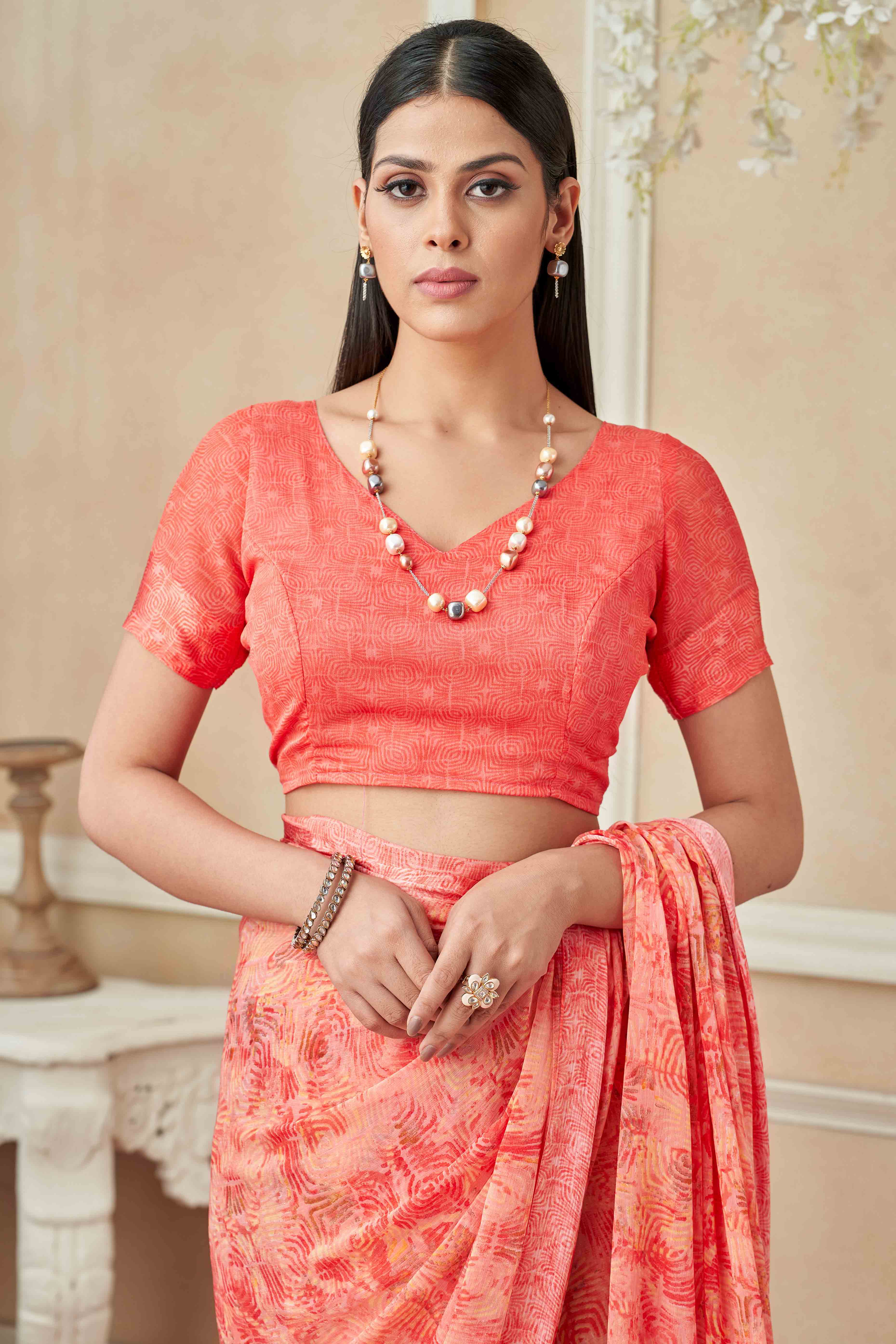 Salmon Pink Chiffon Saree With Delicate Prints & Elegant Satin Woven Border