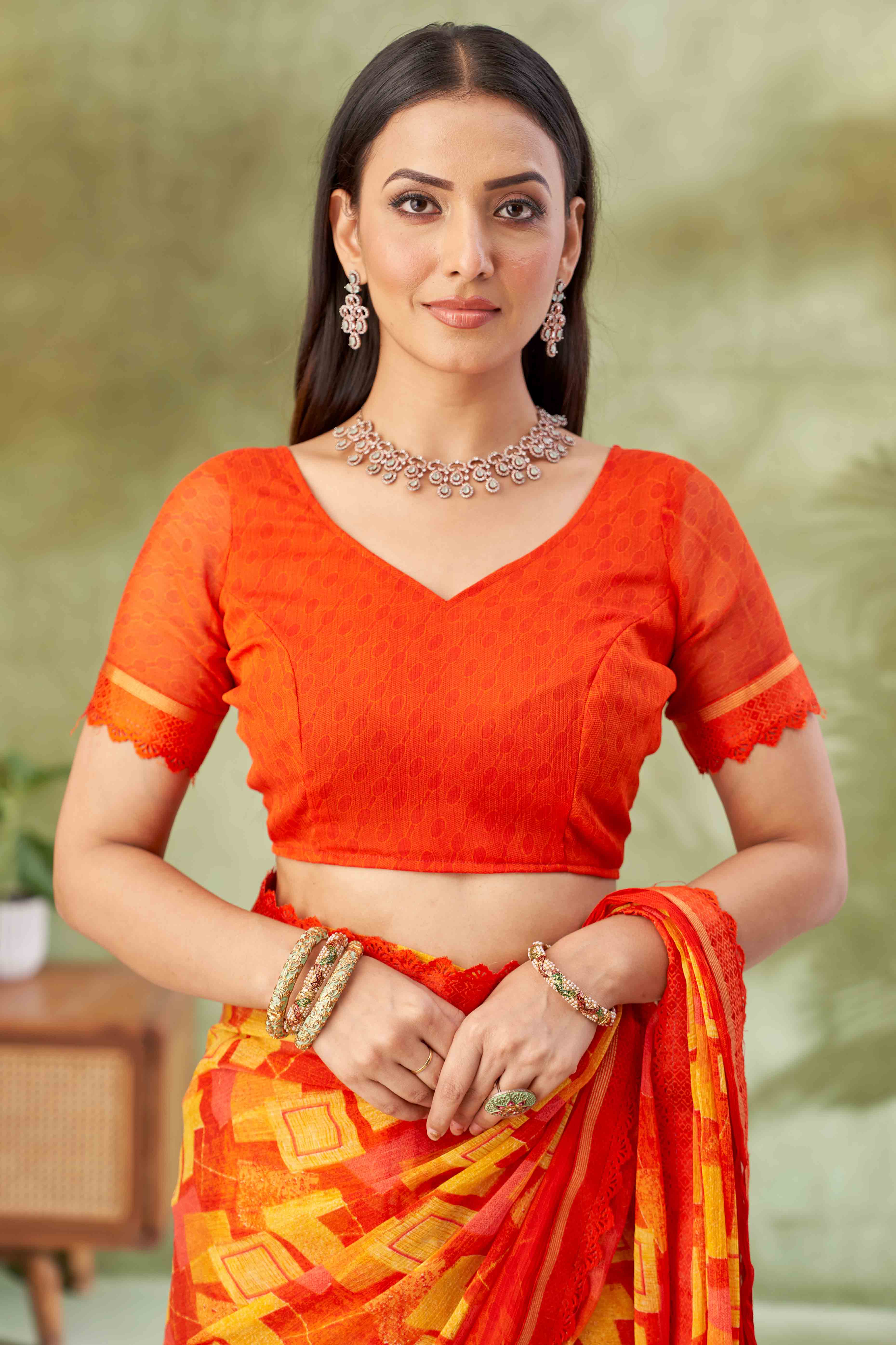 Orange Digital Printed Chiffon Saree Accented With Elegant Lace Border