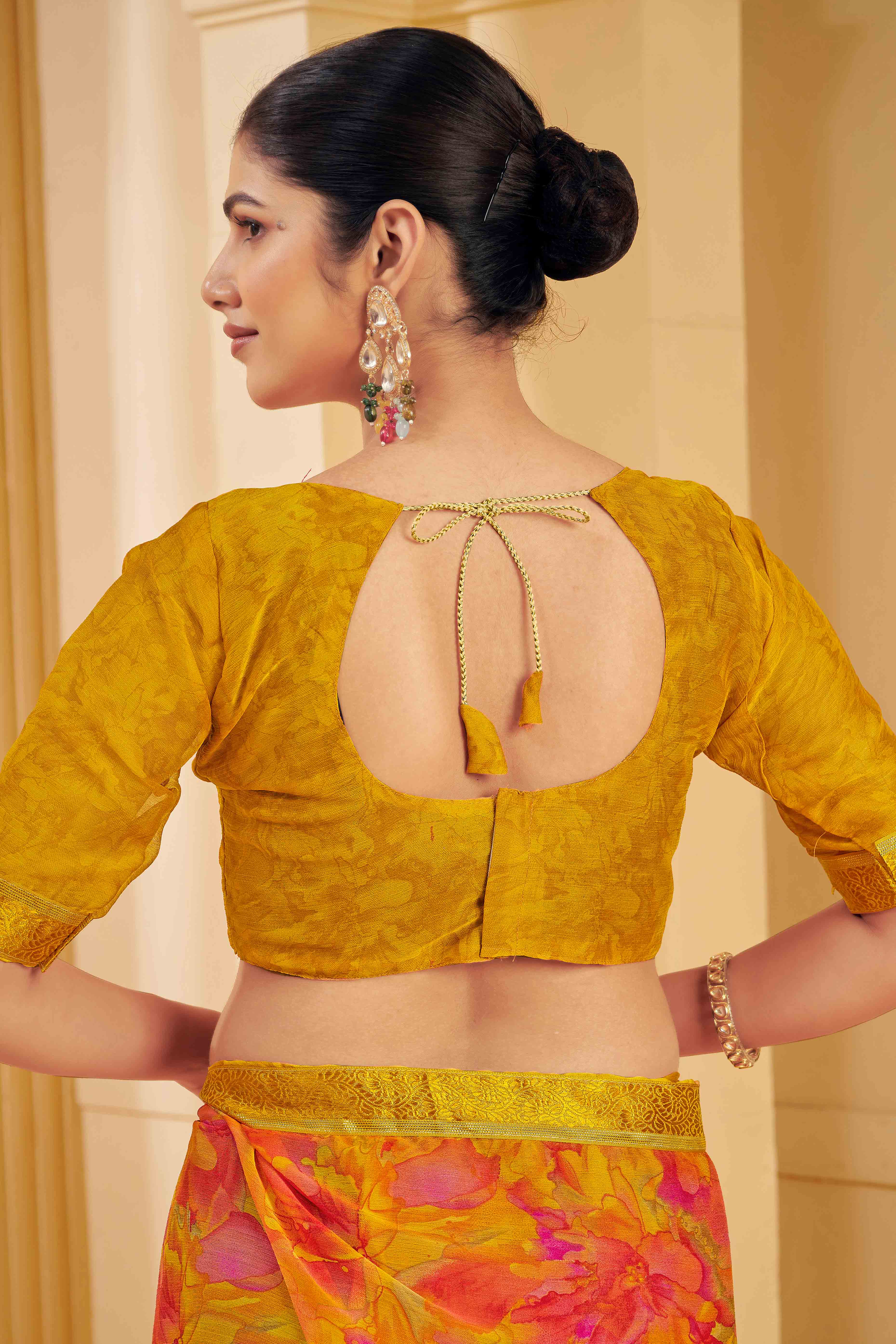 Mustard Chiffon Saree Adorned With Artistic Floral Print & Finely Crafted Woven Lace Border