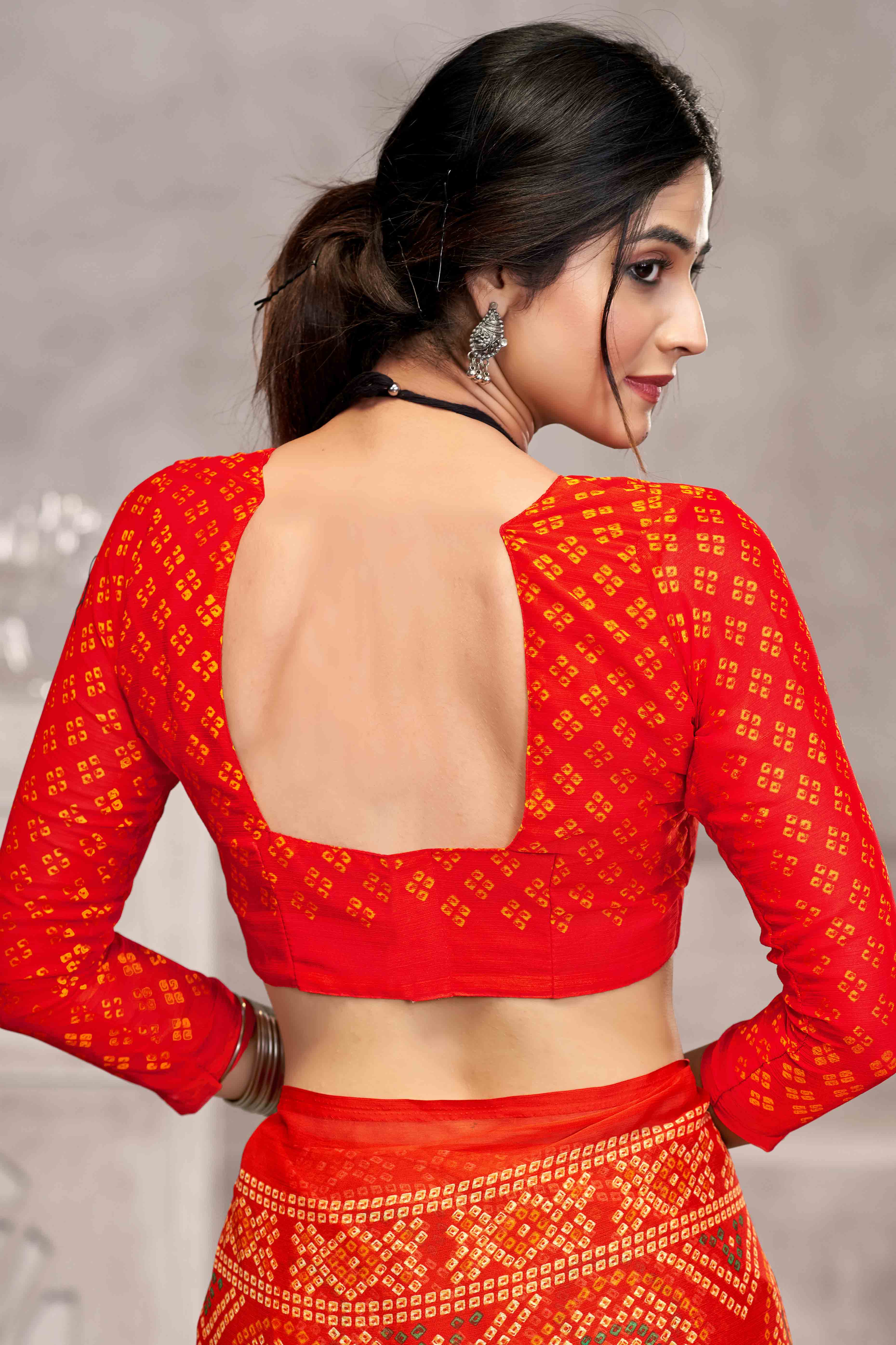 Orange Chiffon Saree Features Bandhani Print for Casual Occasion