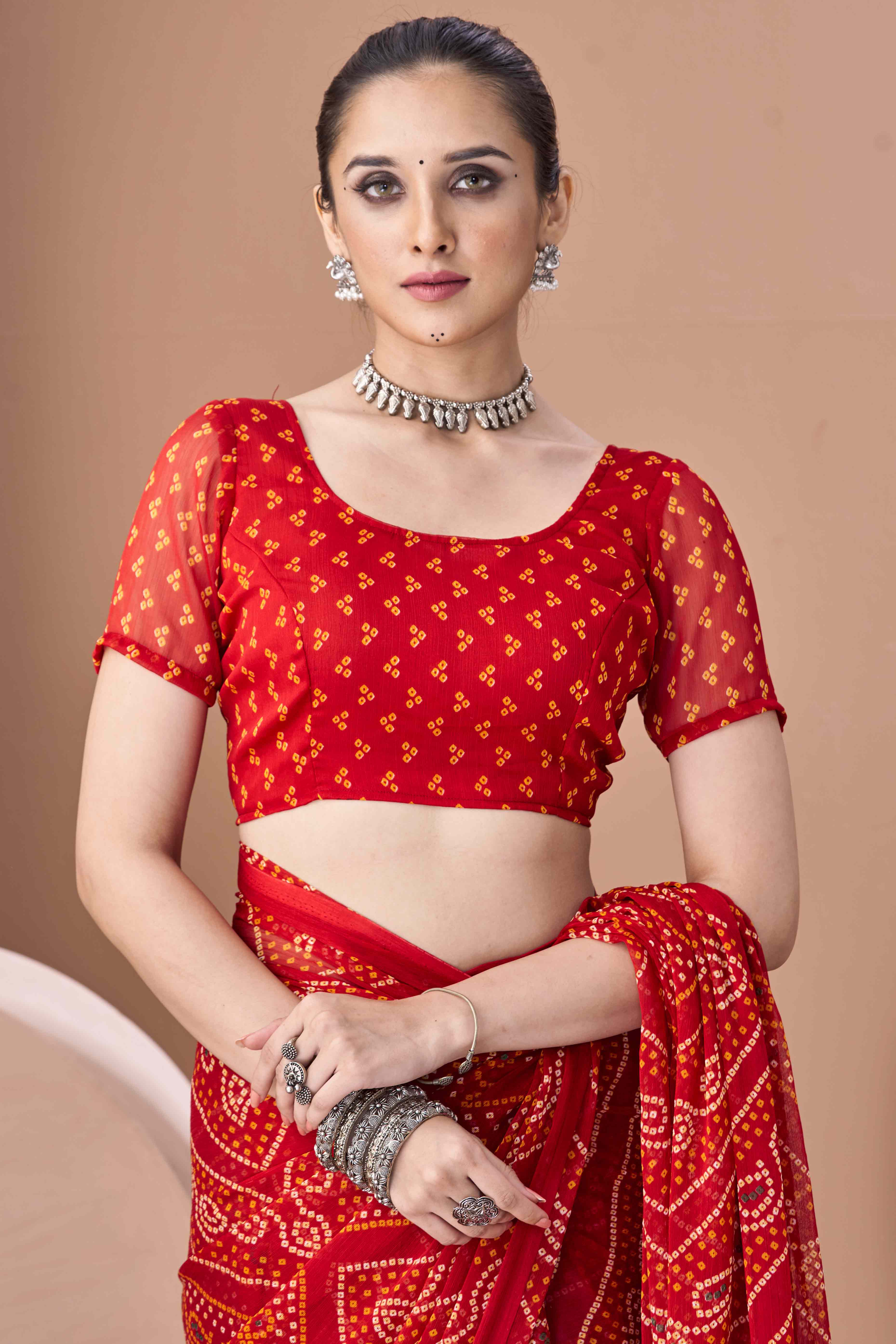 Red Bandhani Printed Chiffon Saree Accented With Intricate Lace Border Work