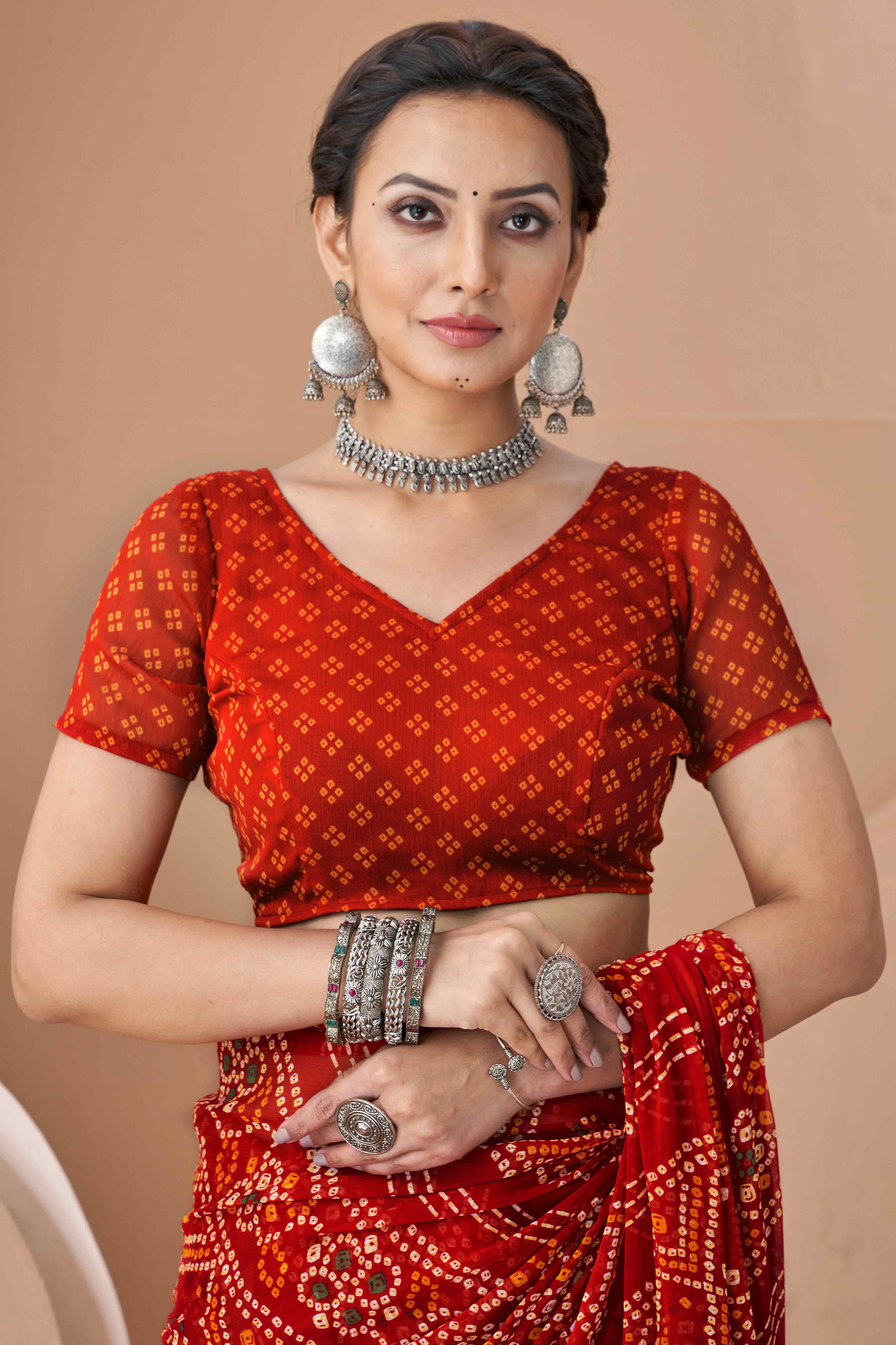 Red Bandhani Printed Chiffon Saree Accented With Intricate Lace Border Work