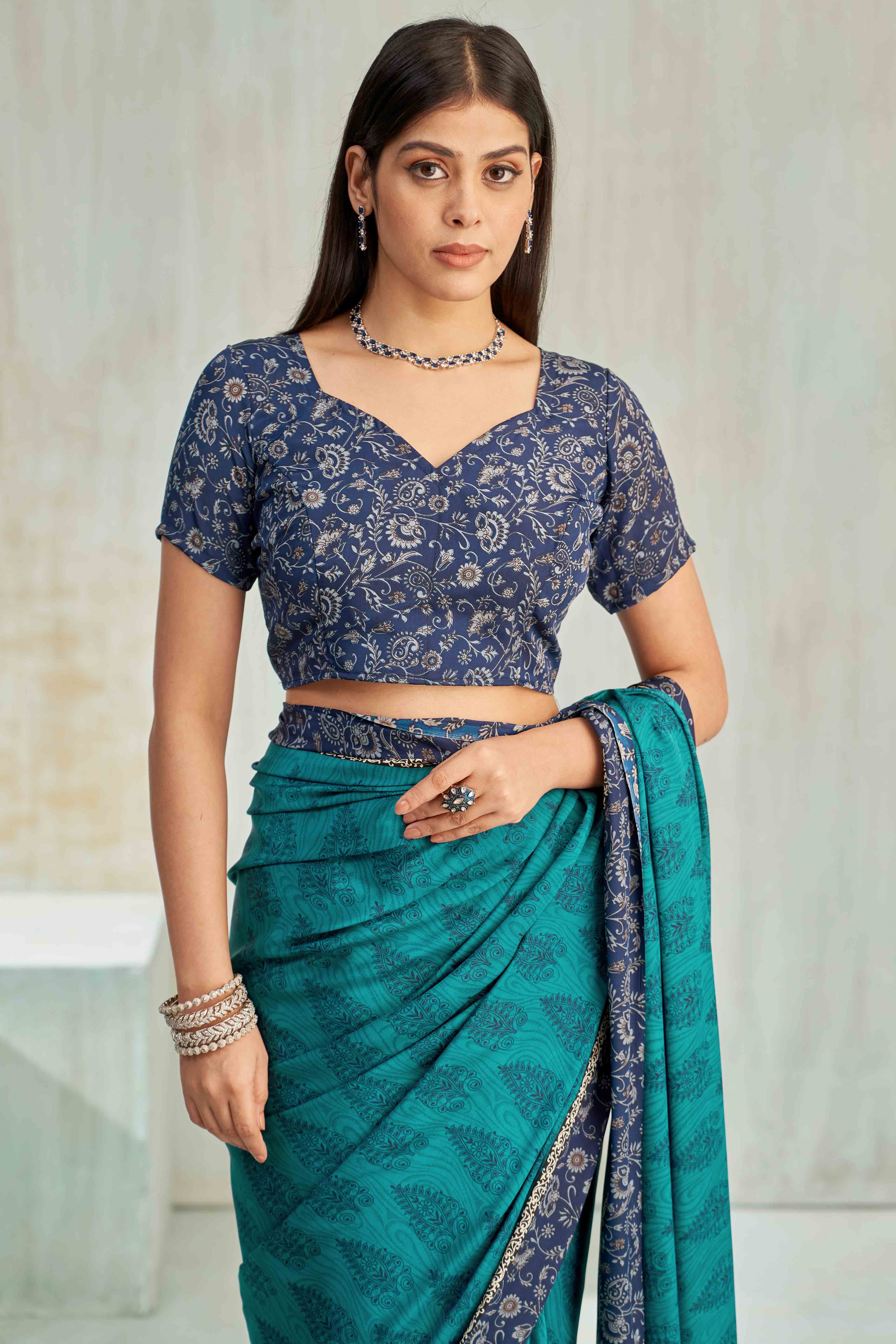 Teal Crepe Silk Saree Featuring Delicate Floral Print Work