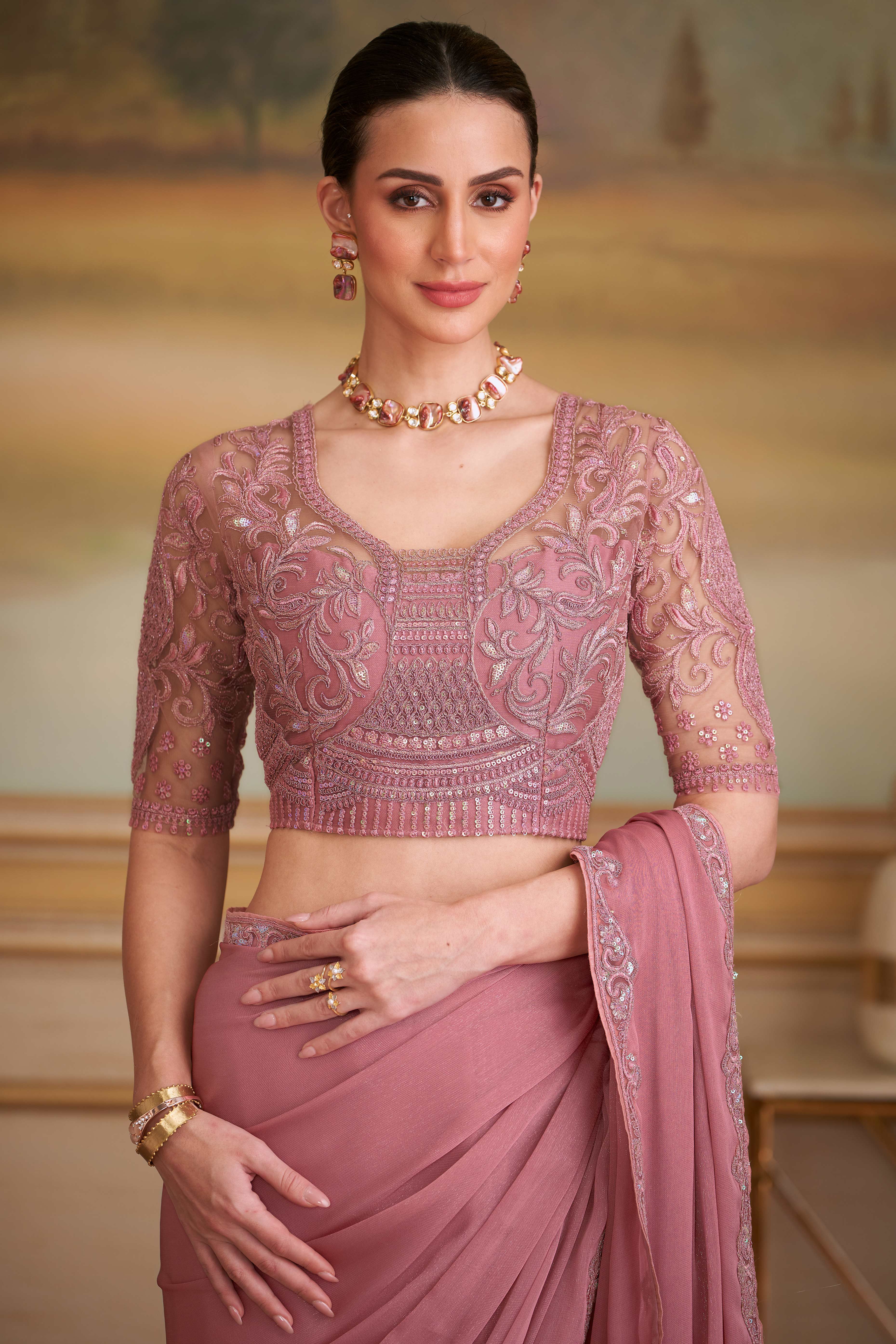 Graceful Onion Pink Sparkle Georgette Saree Adorned With Floral Sequins Embroidered Lace Border