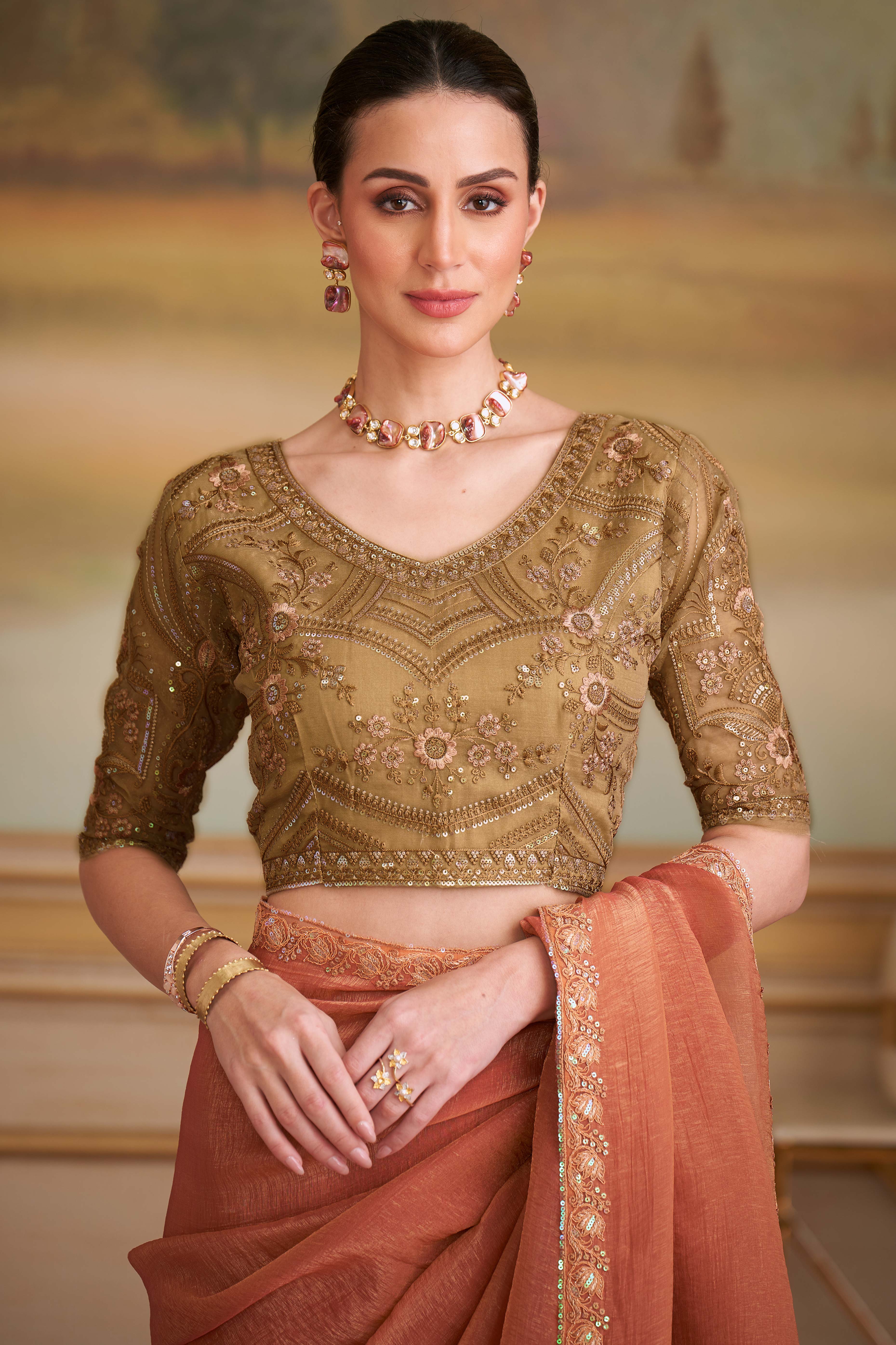 Sophisticated Rust Orange Gold Georgette Saree Accented With Floral Sequins Embroidered Lace Border