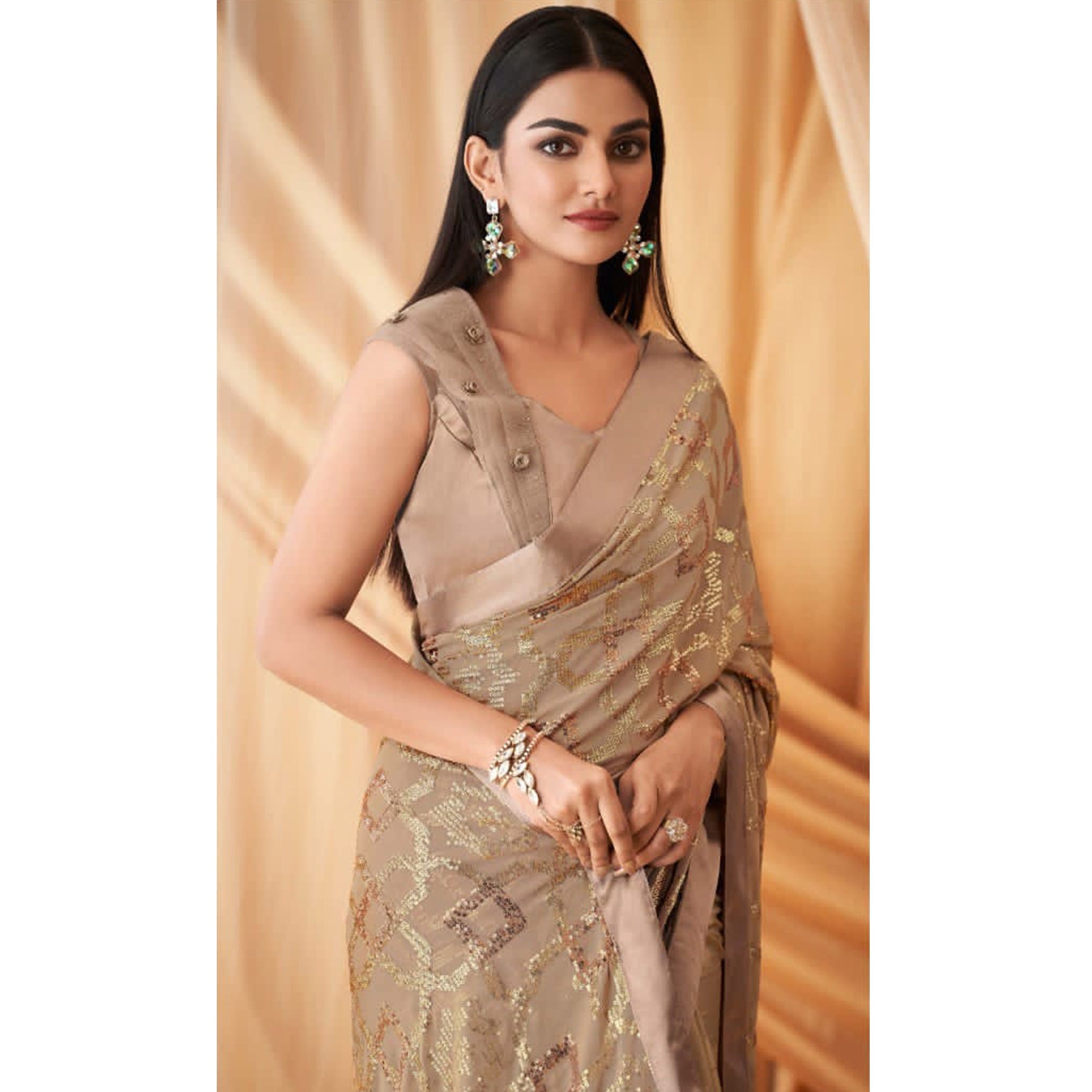 Beige Sequins Embroidered Georgette Saree With Tassels