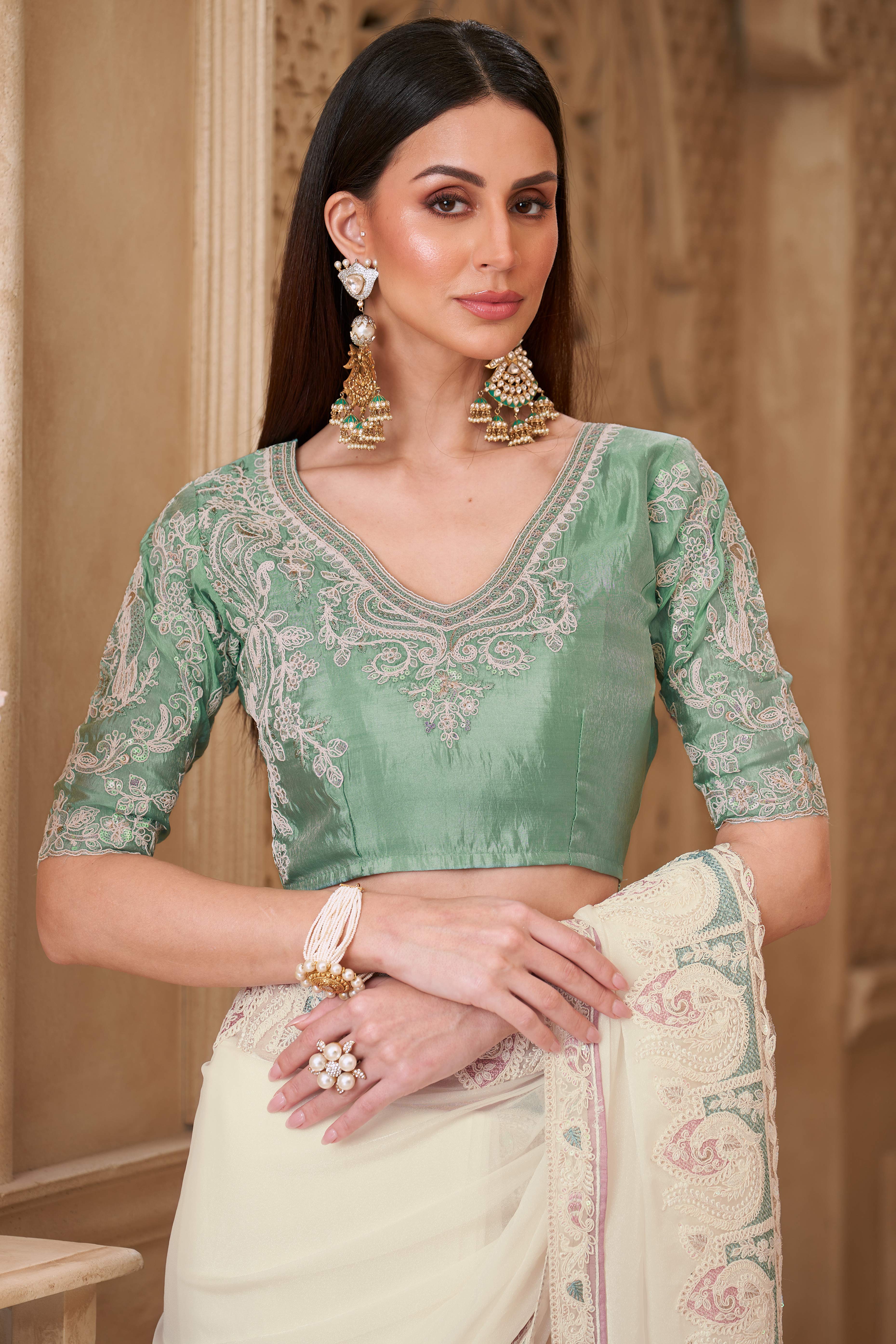 Shimmering Cream Georgette Saree with Graceful Thread Embellishment and Sequins