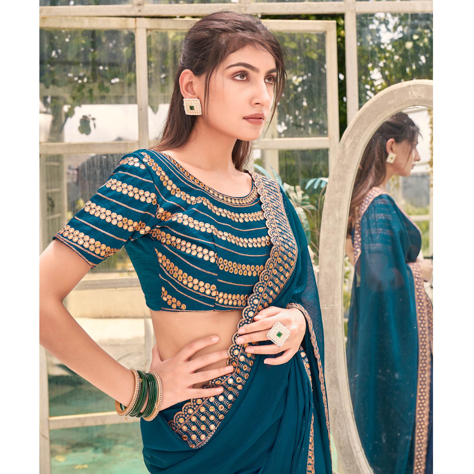 Teal Solid With Embroidered Border Georgette Saree