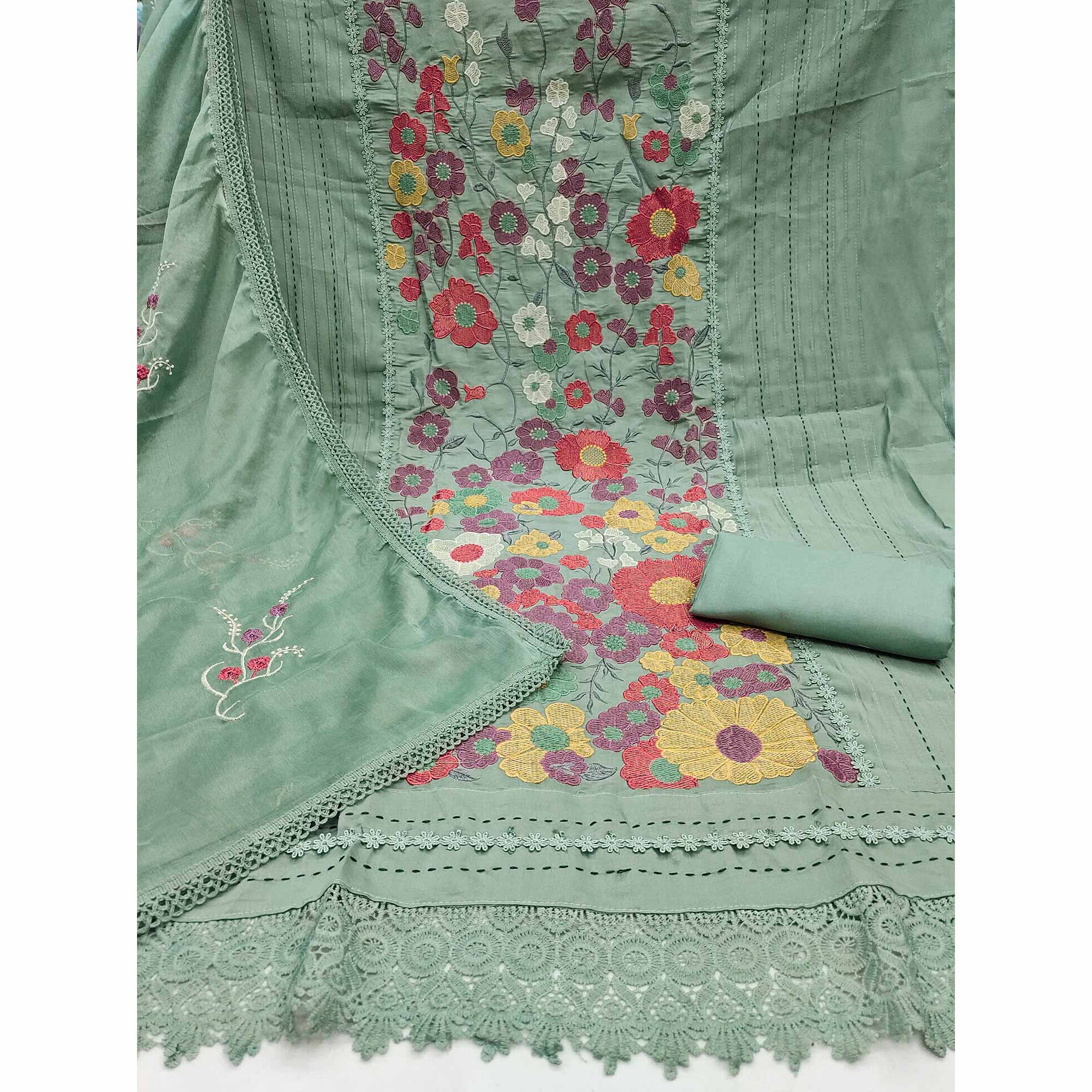 Green Roman Cotton Silk Dress Material Adorned With Elegant Floral Thread Embroidered Work