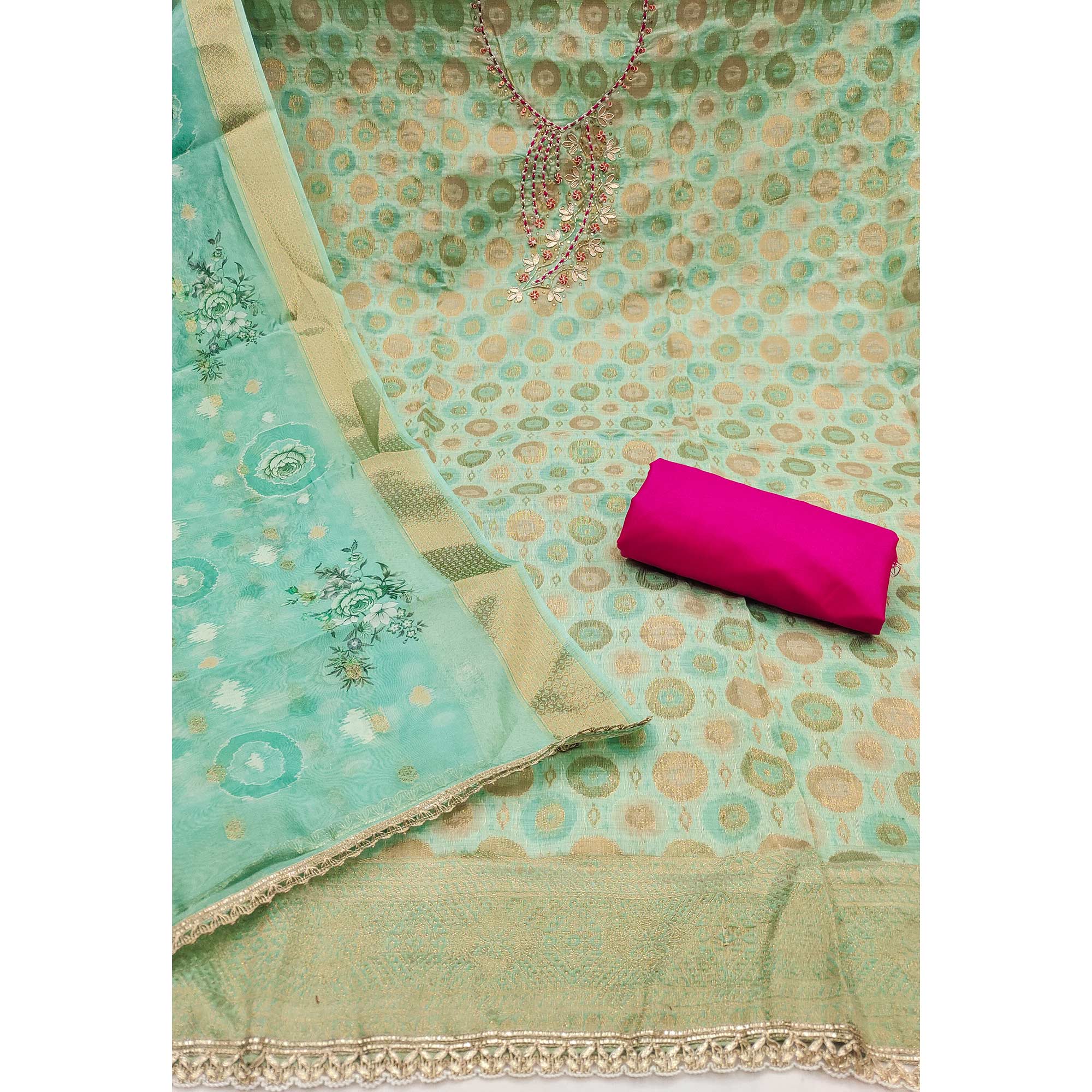 Sophisticated Turquoise Zari Woven Jacquard Dress Material Highlighted With Floral Handwork