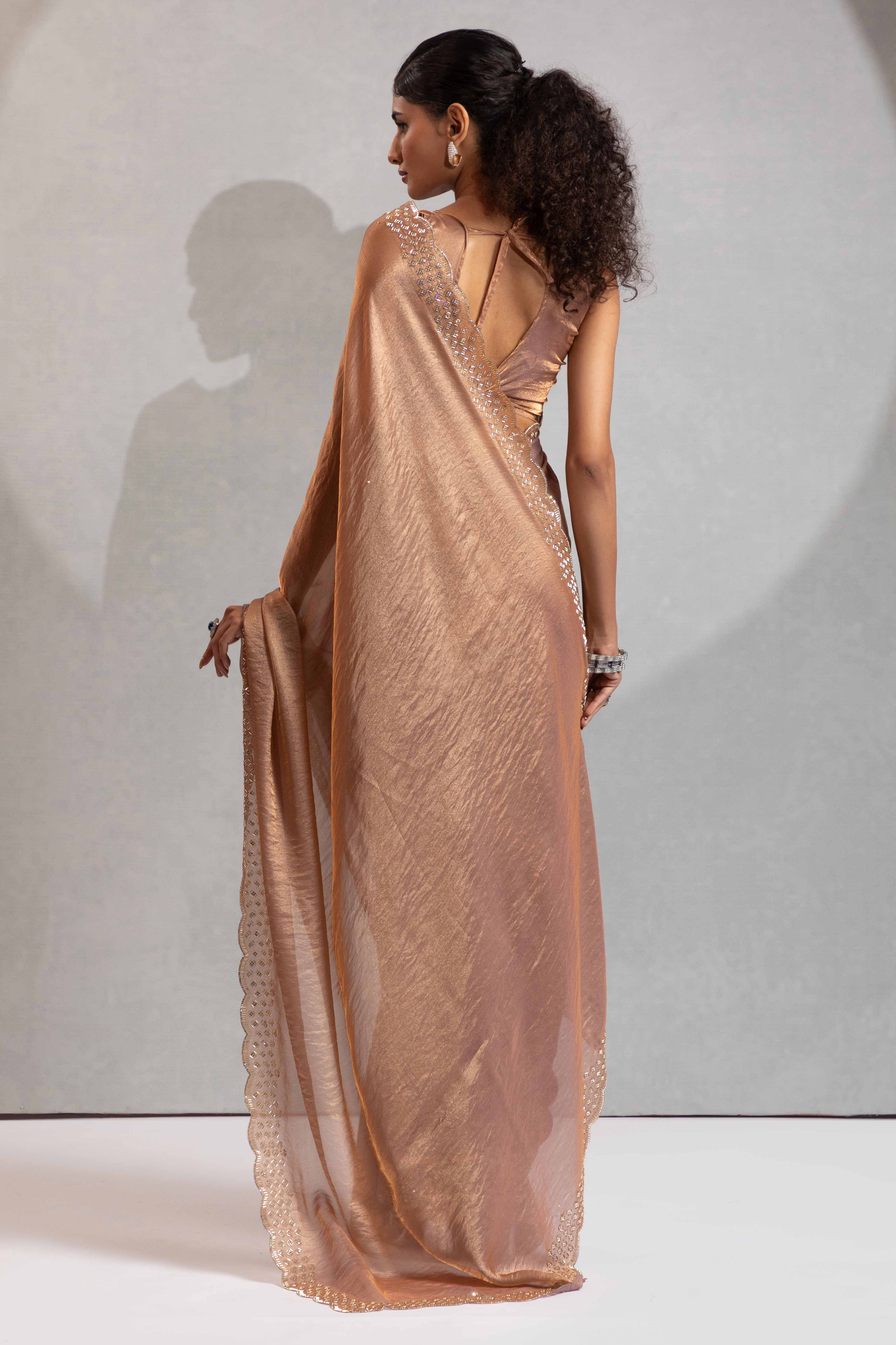 Shimmery Brown Satin Saree with Glamorous Stone Embellishment