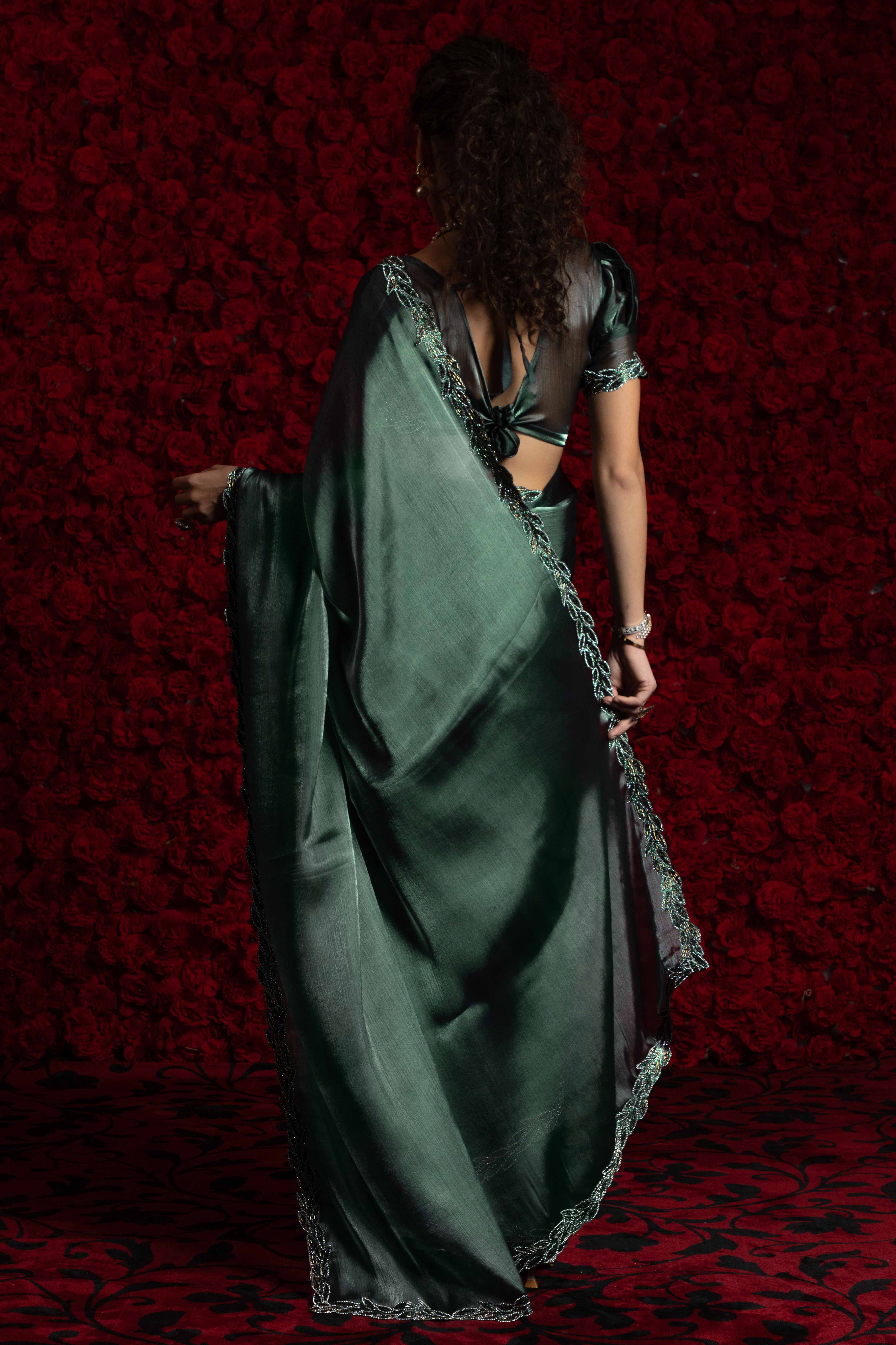 Emerald Green Solid Tissue Chiffon Saree Accented With Elegant Zarkan Work Border