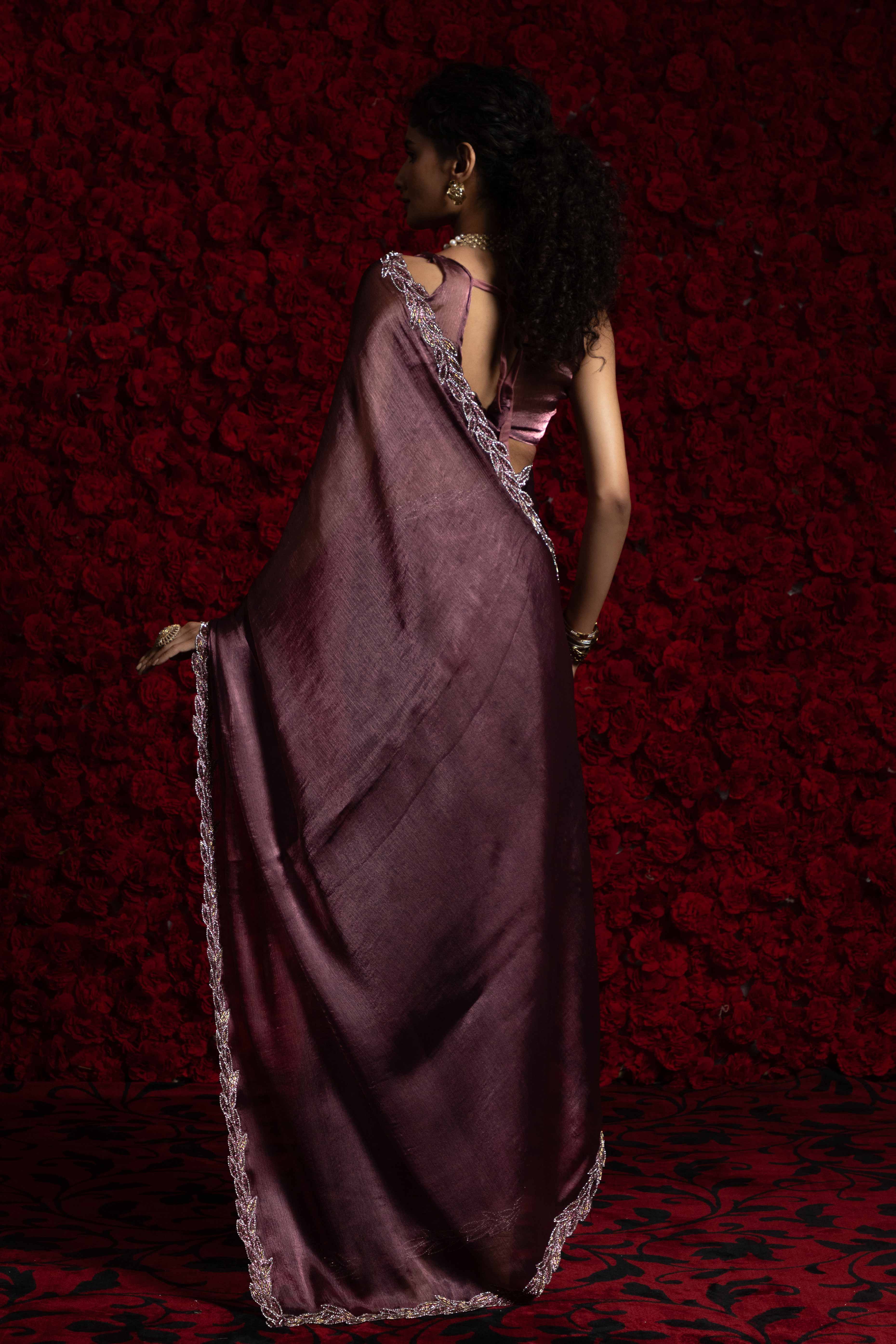 Deep Mauve Solid Tissue Chiffon Saree Accented With Elegant Zarkan Work Border