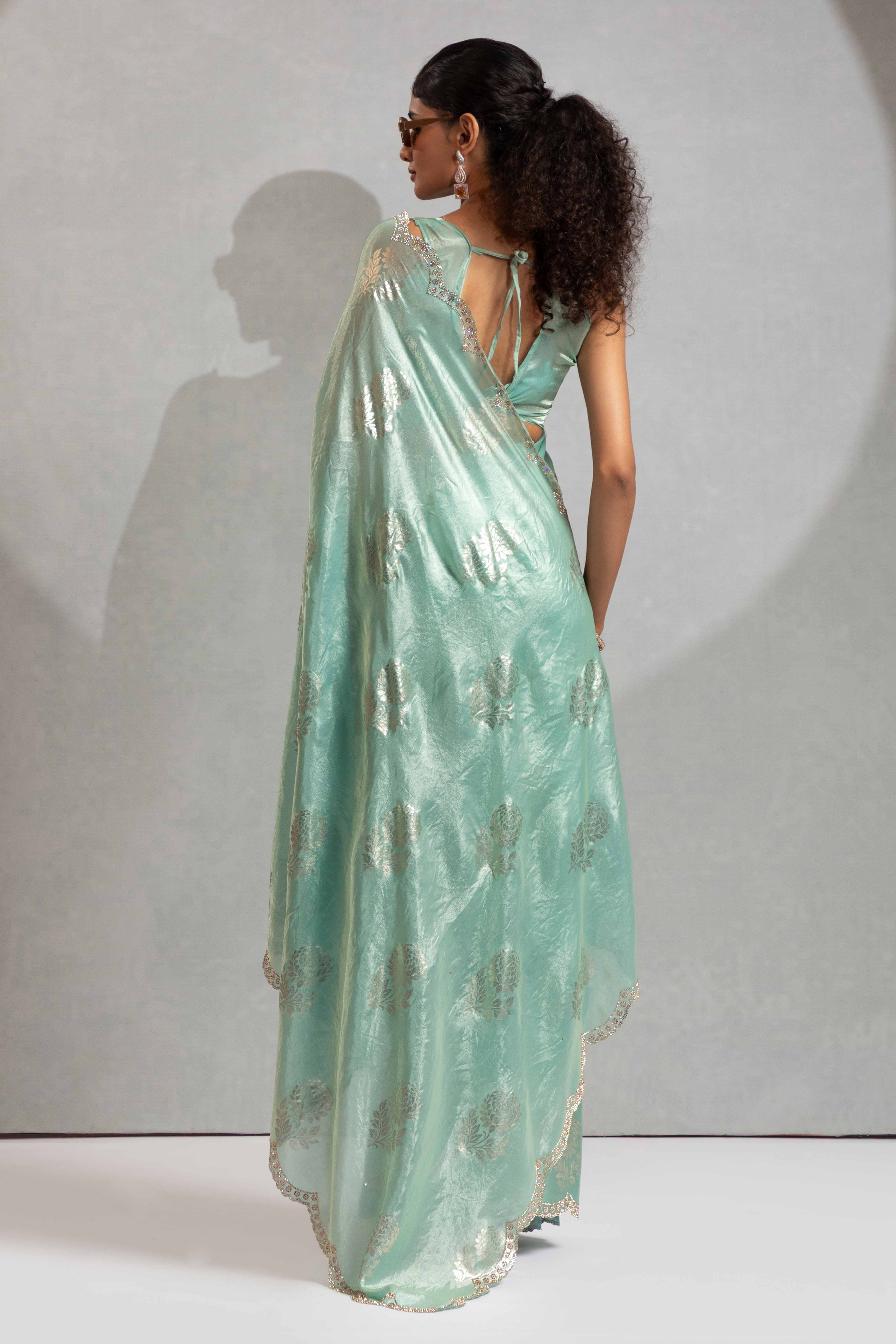 Turquoise Satin Silk Saree Showcasing Elegant Floral Foil Prints & Dazzling Zarkan Work