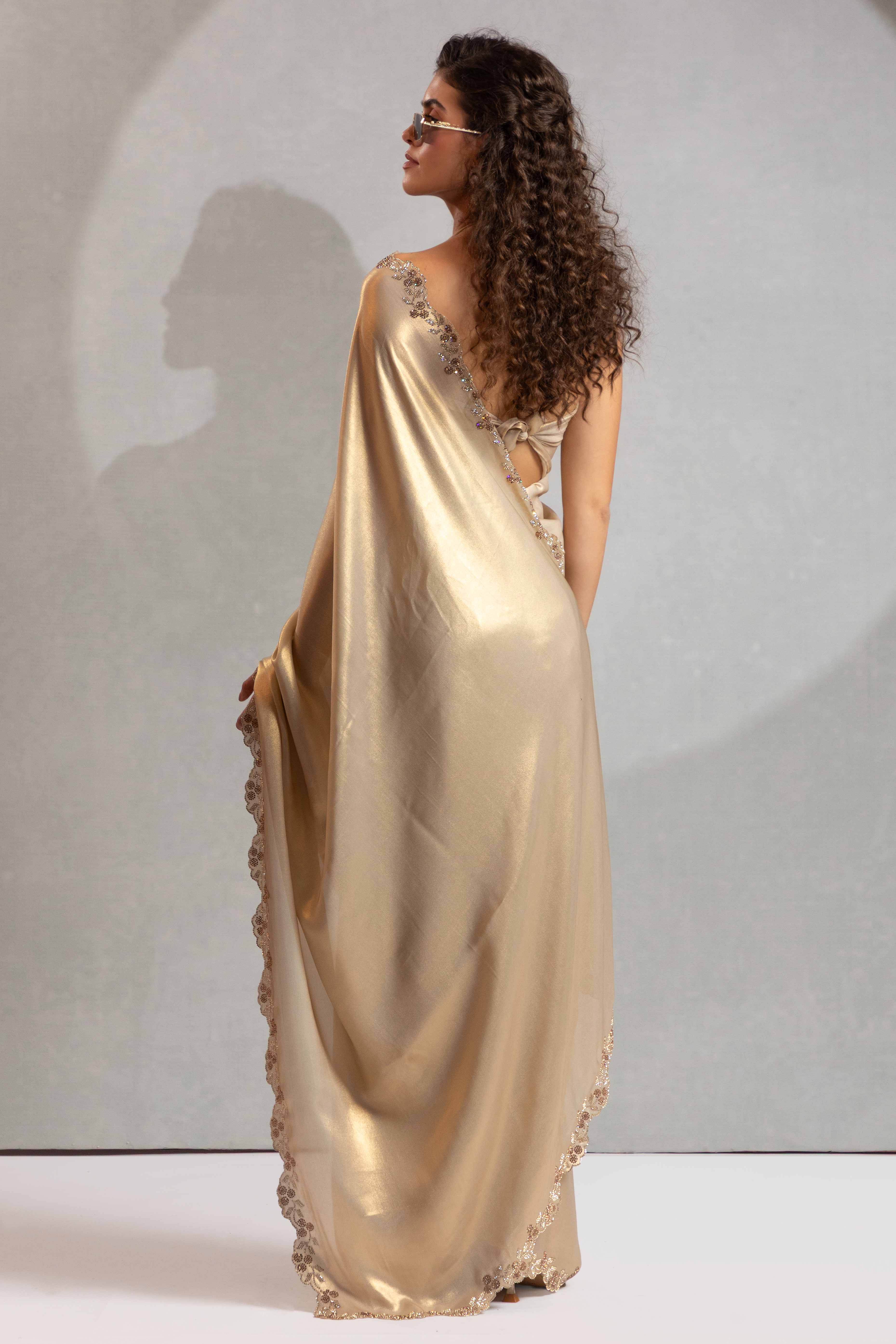 Beige Satin Georgette Saree Adorned With Subtle Foil Finish & A Sparkling Zarkan Work Border