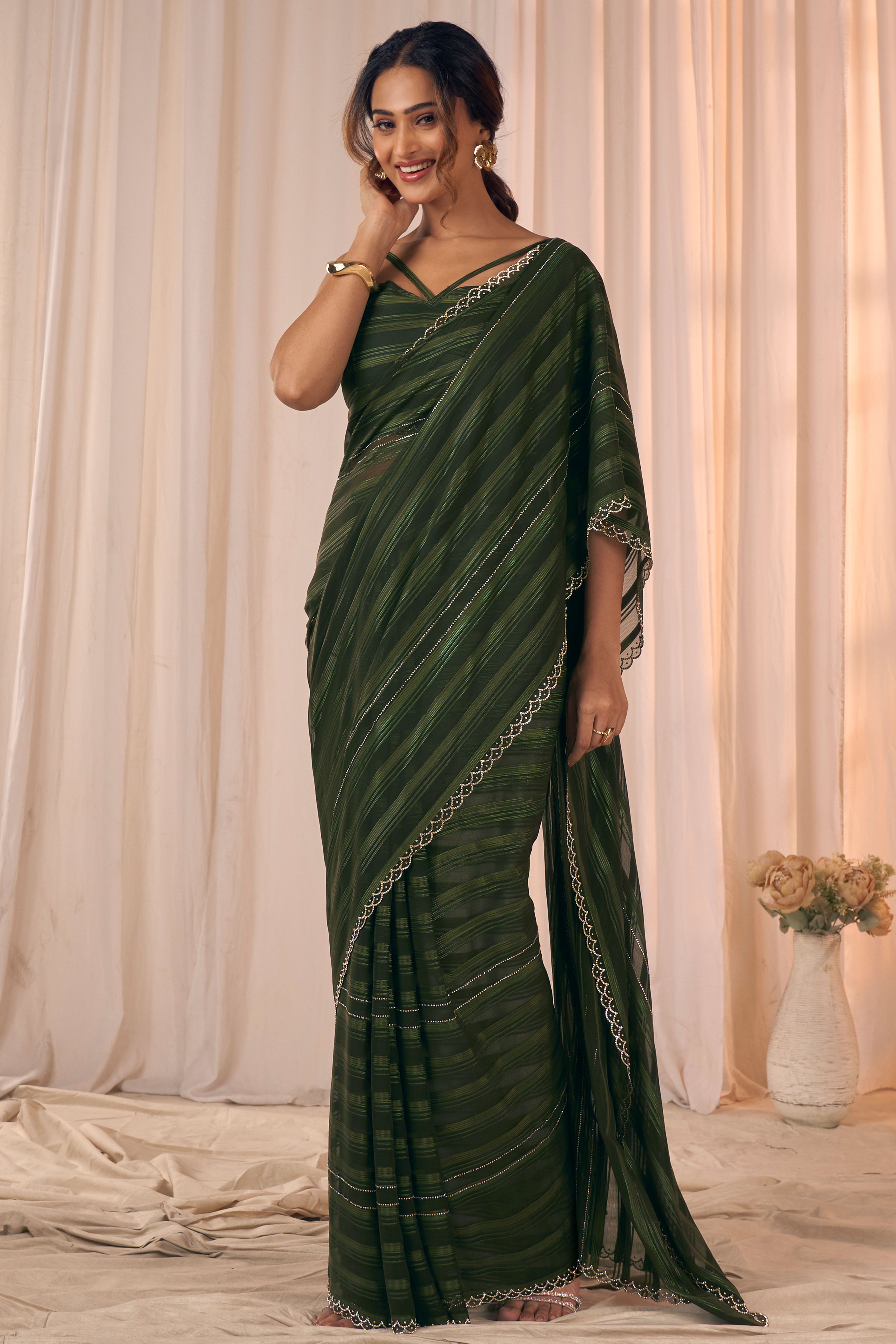 Dark Olive Striped Designer Georgette Saree Adorned With An Elegant Zarkan Cutwork Border