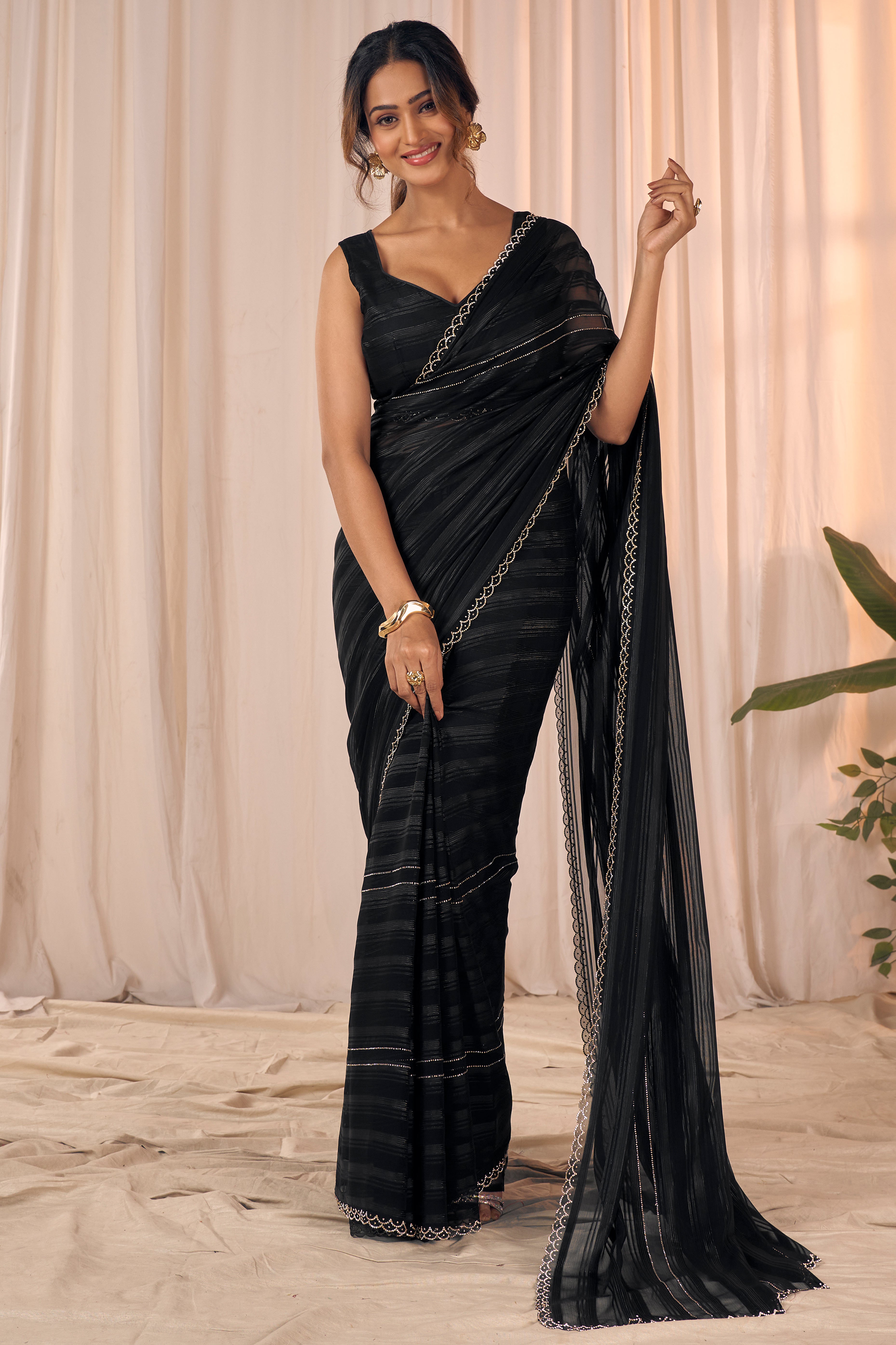 Black Striped Designer Georgette Saree Adorned With An Elegant Zarkan Cutwork Border