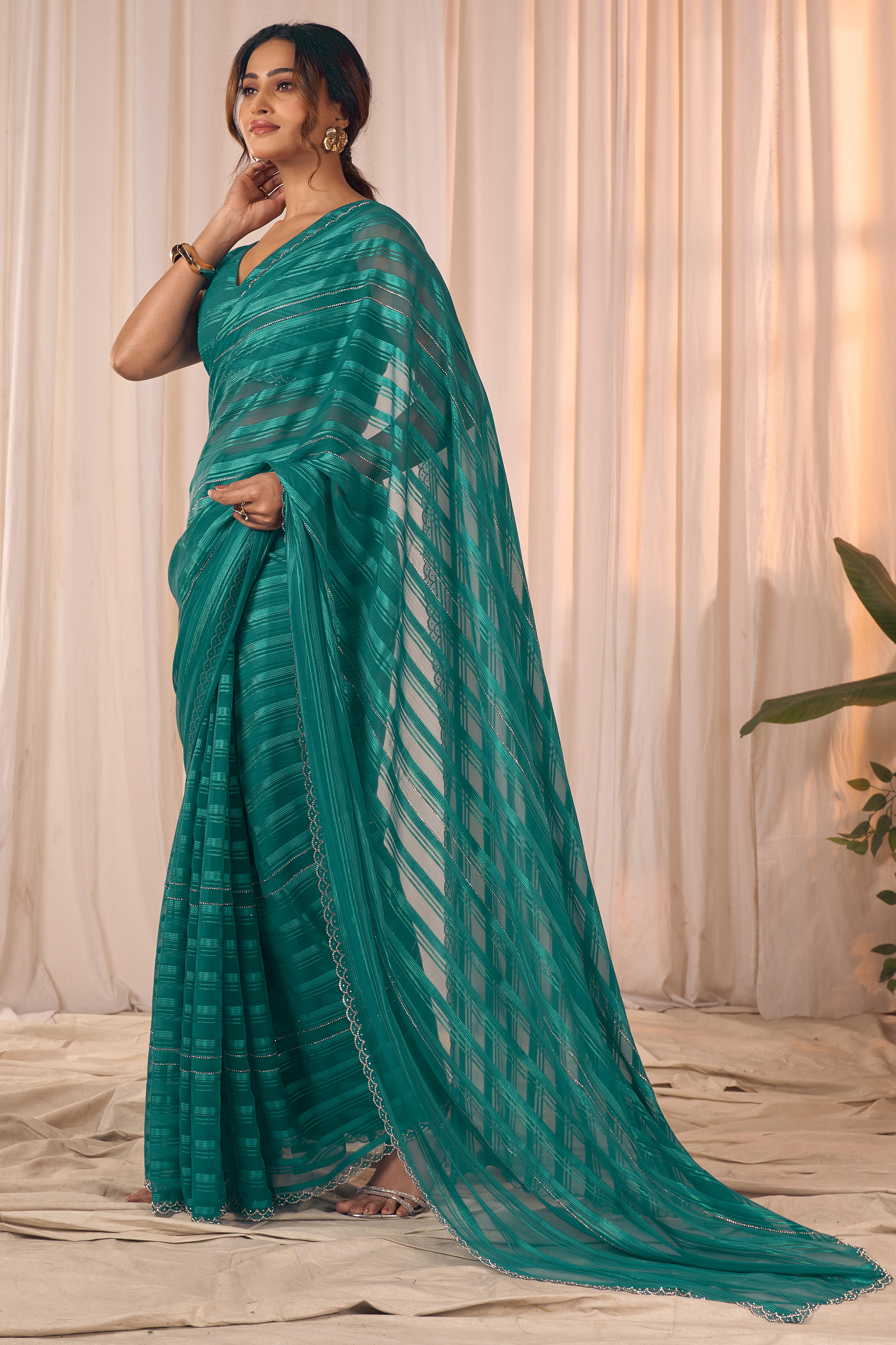 Teal Striped Designer Georgette Saree Adorned With An Elegant Zarkan Cutwork Border