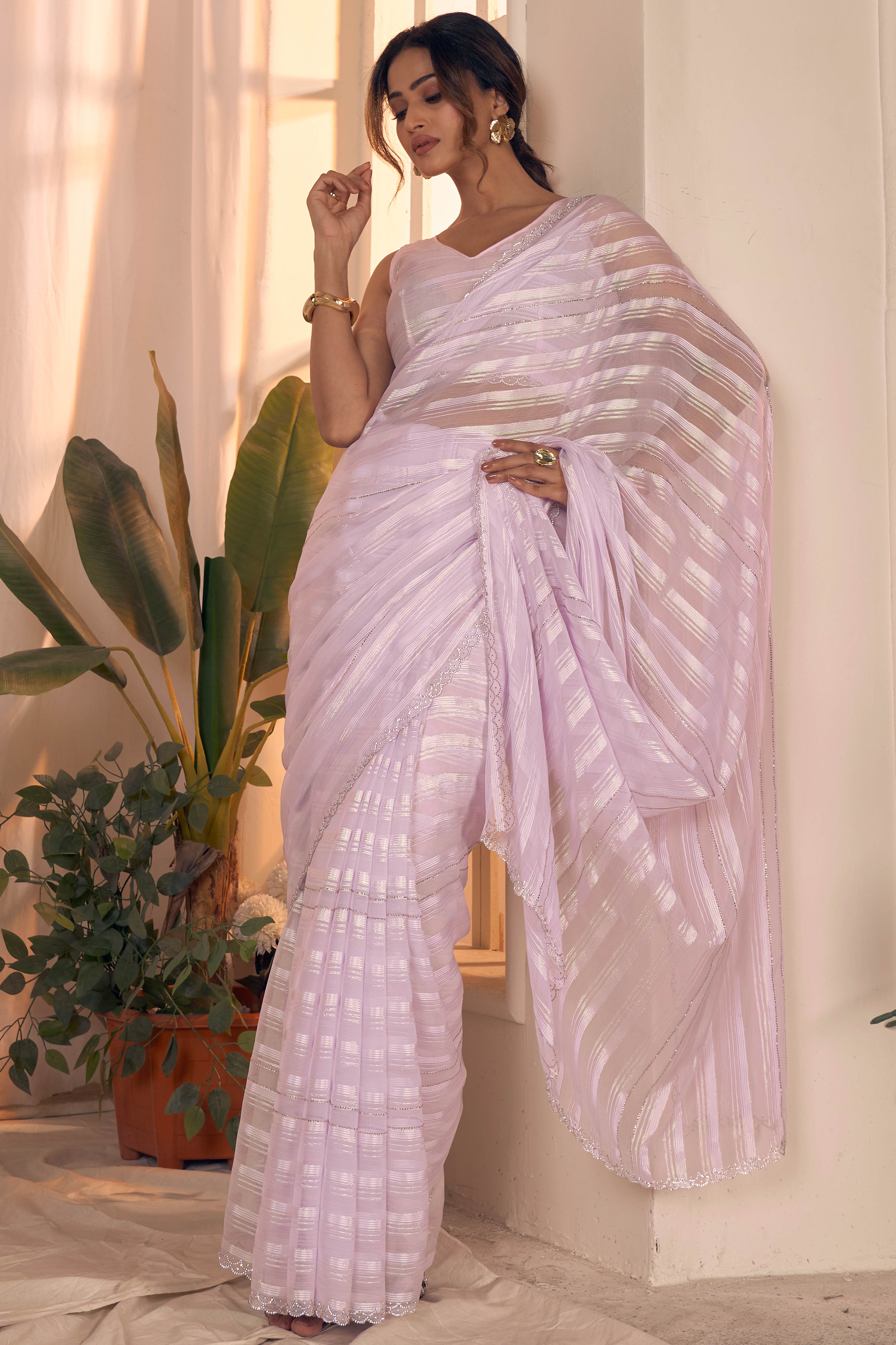 Light Lavender Striped Georgette Saree With Sparkling Zarkan Work & An Elegant Cutwork Border
