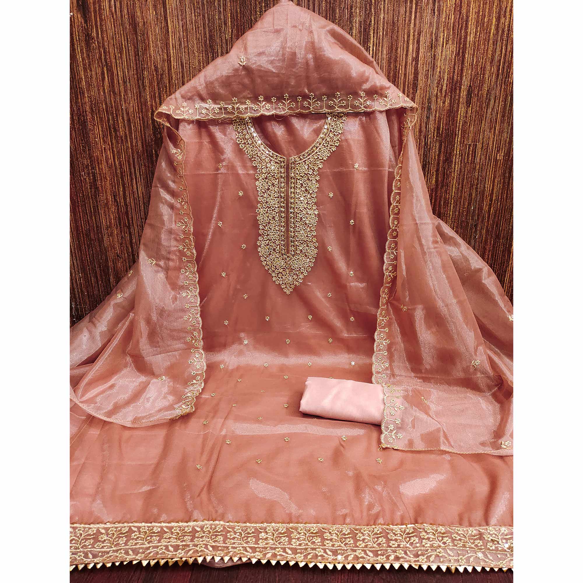 Peach Designer Suit Material in Sheer Twill Net with Thread Embroidered Patterns