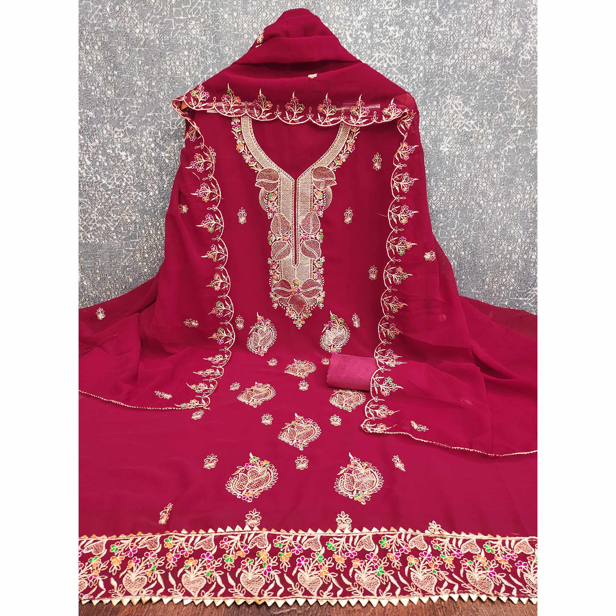 Rani Pink Georgette Dress Material Adorned With Floral Embroidery & Elegant Lace Border