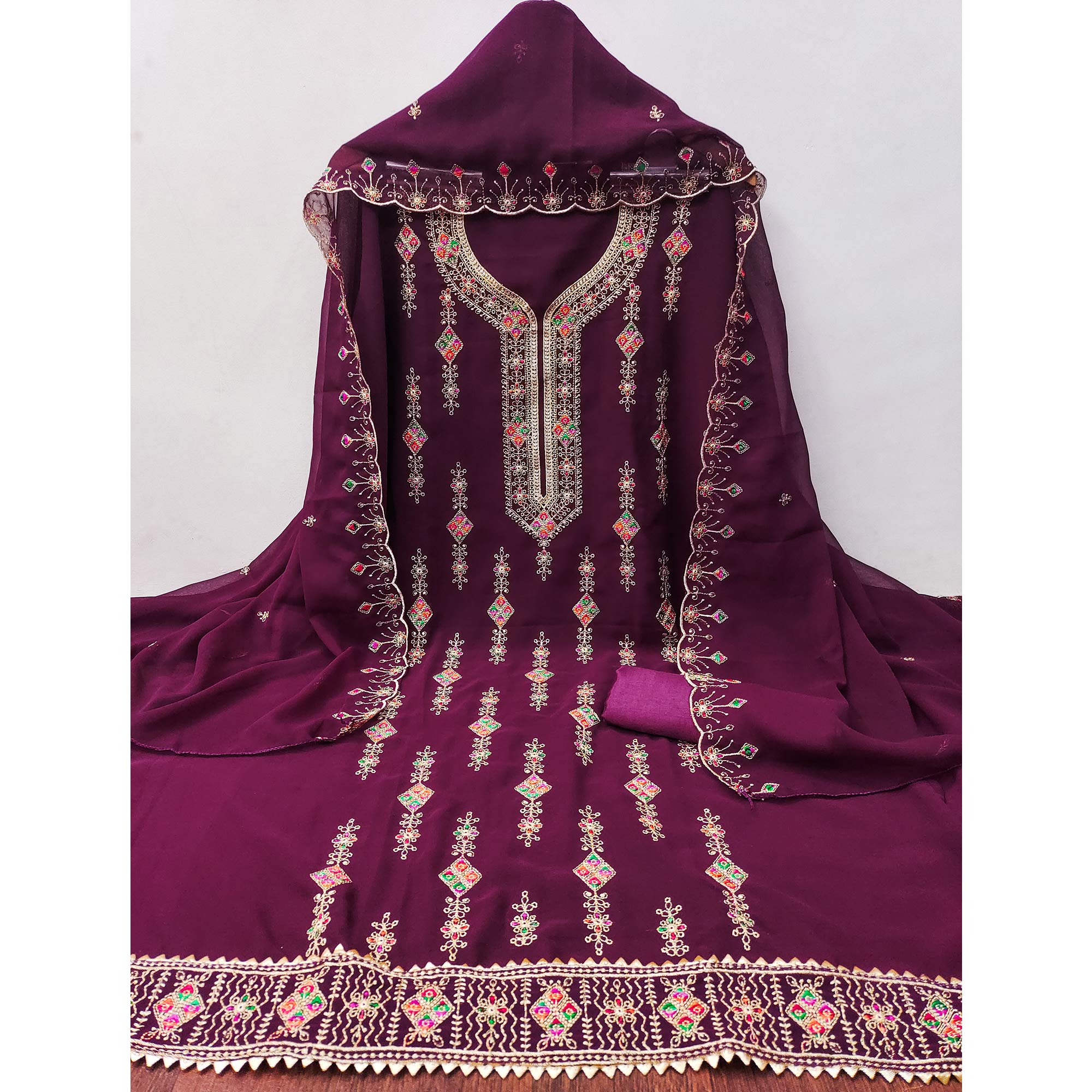 Wine Georgette Dress Material Enhanced With Graceful Floral Embroidery For An Elegant Ethnic Look