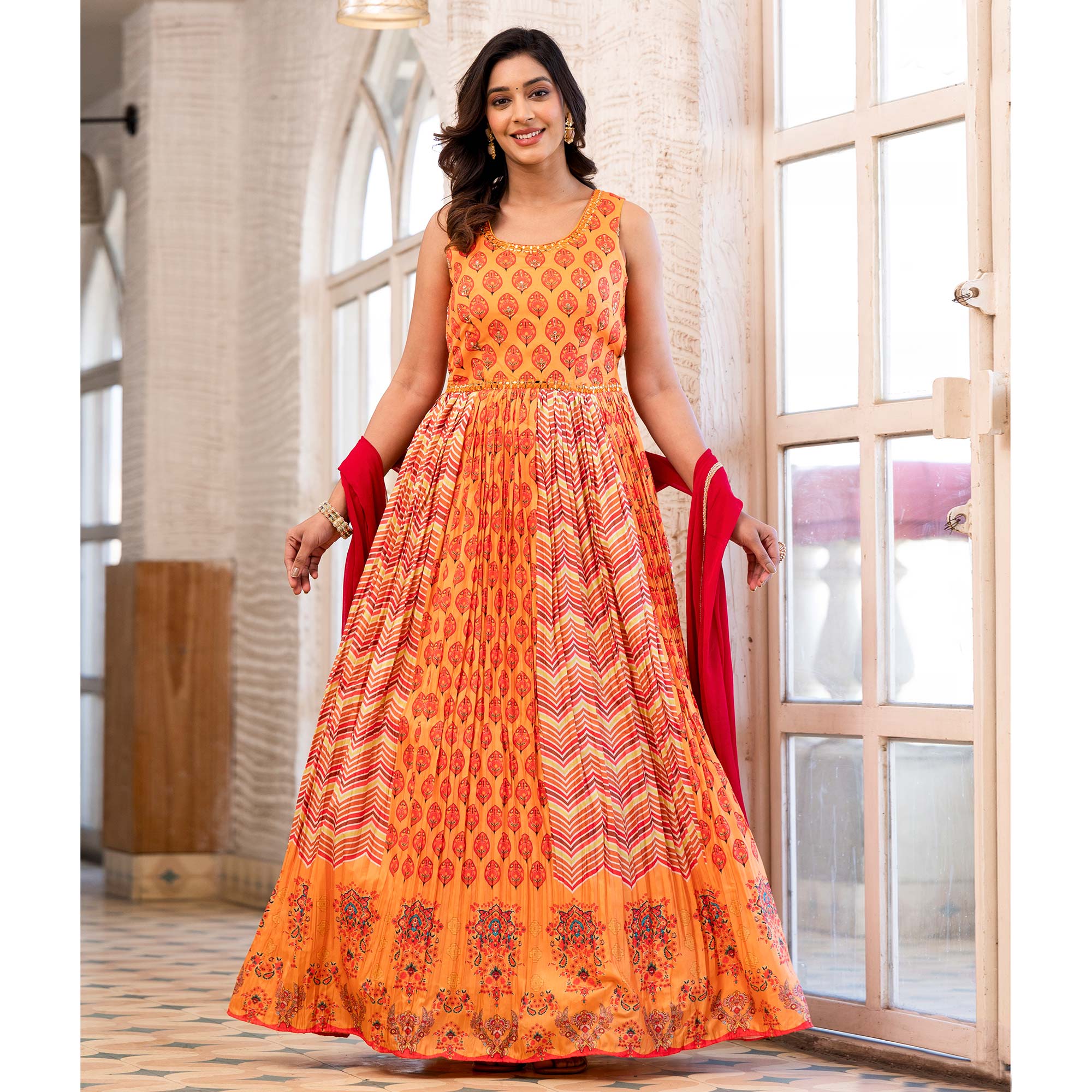 Orange Printed Dola Silk Anarkali Style Gown With Mirror Work