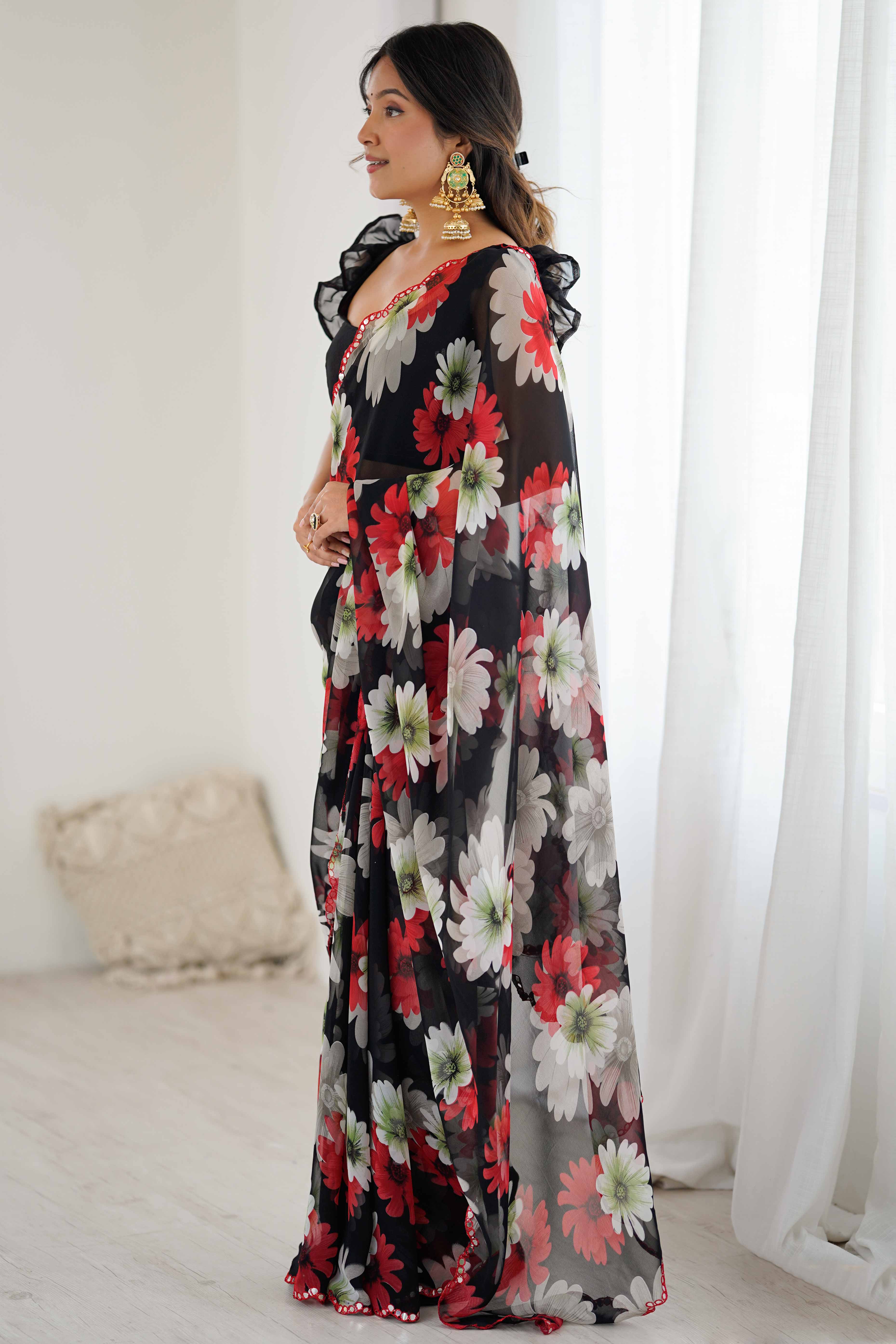 Black Georgette Saree Featuring Floral Prints & Shimmering Mirror Work Border