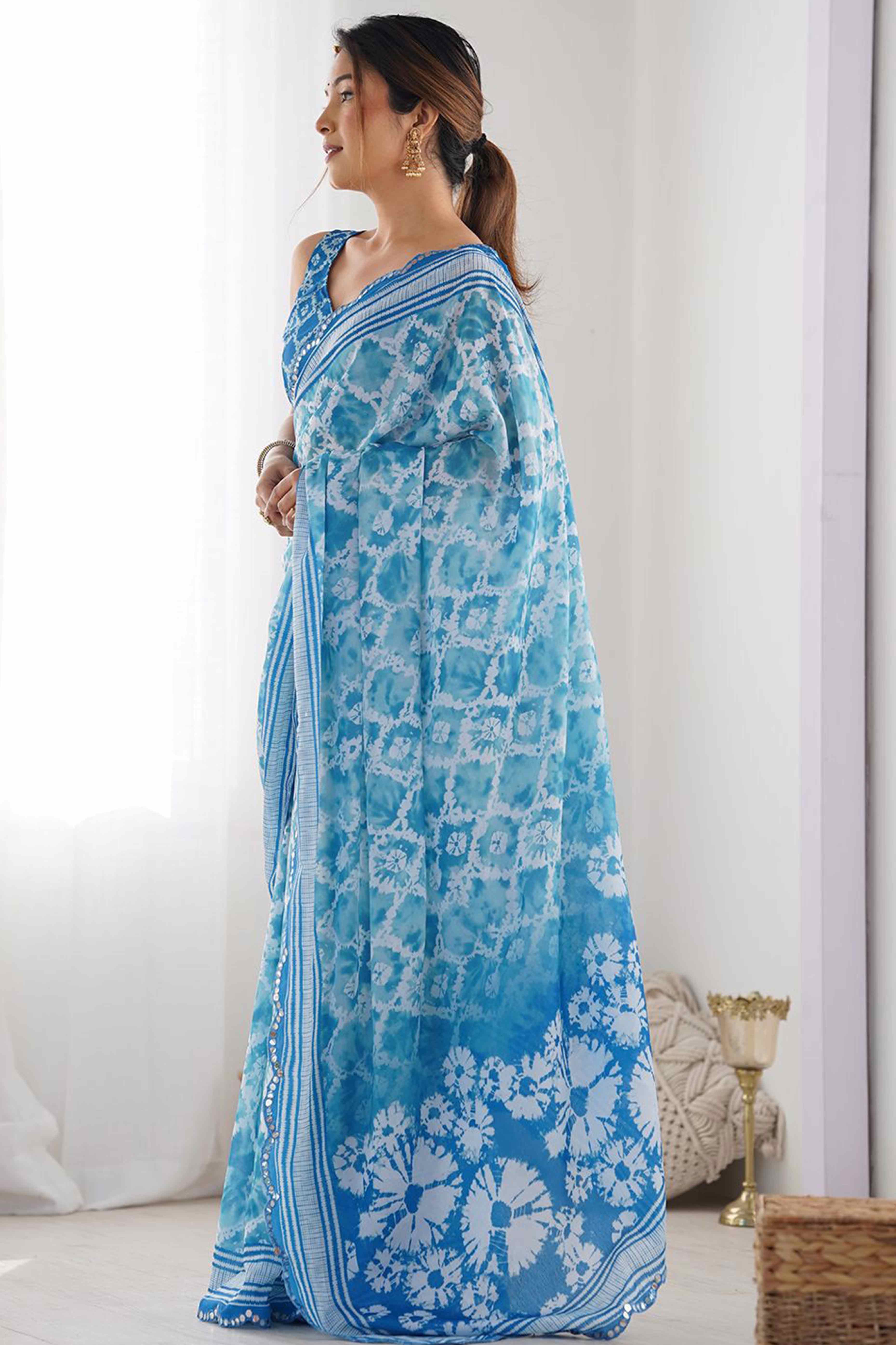 Sky Blue Digital Print Georgette Saree Enhanced With A Sparkling Lace Border