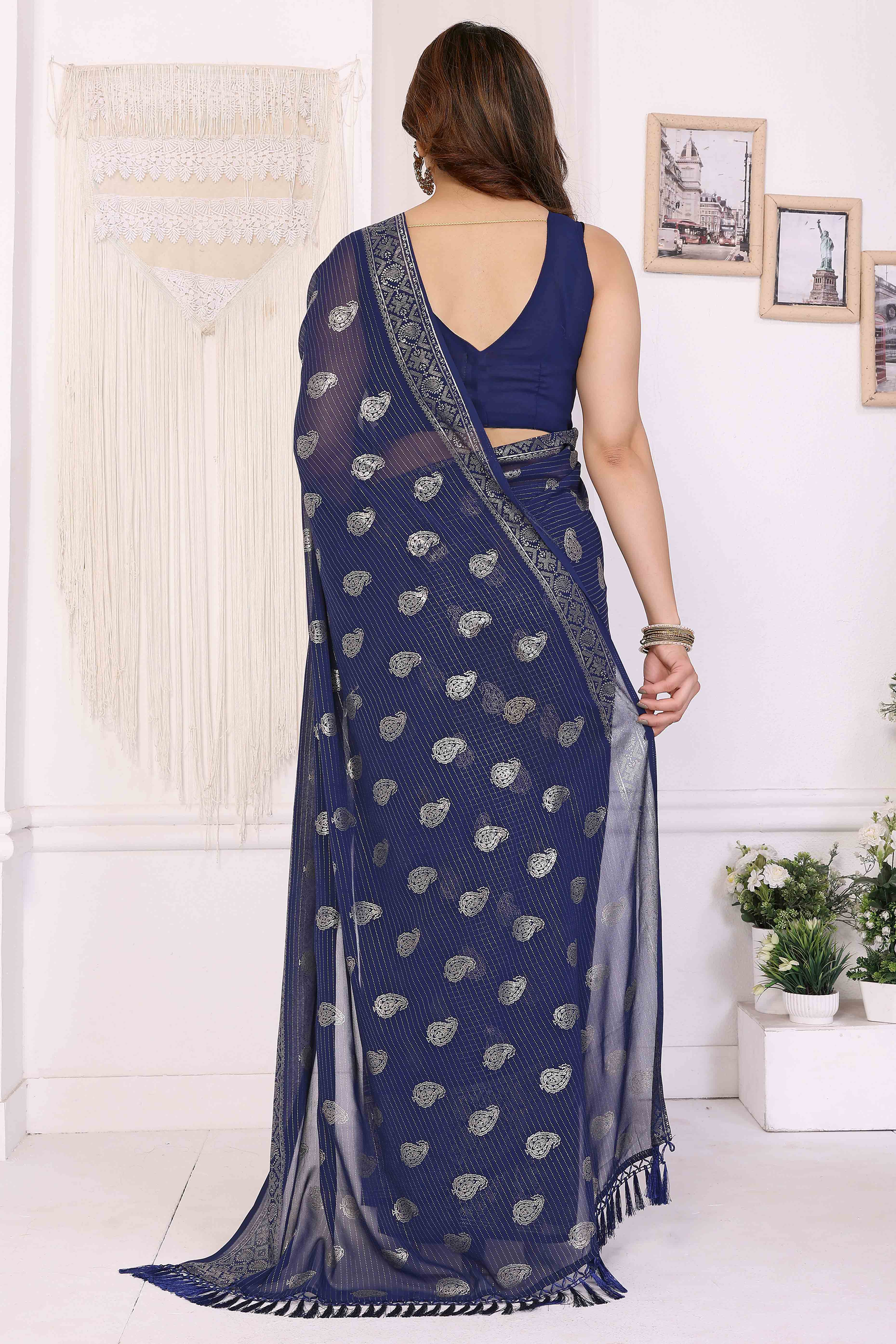 Blue Foil Printed Georgette Saree Enhanced With Delicate Lace Border & Elegant Tassel